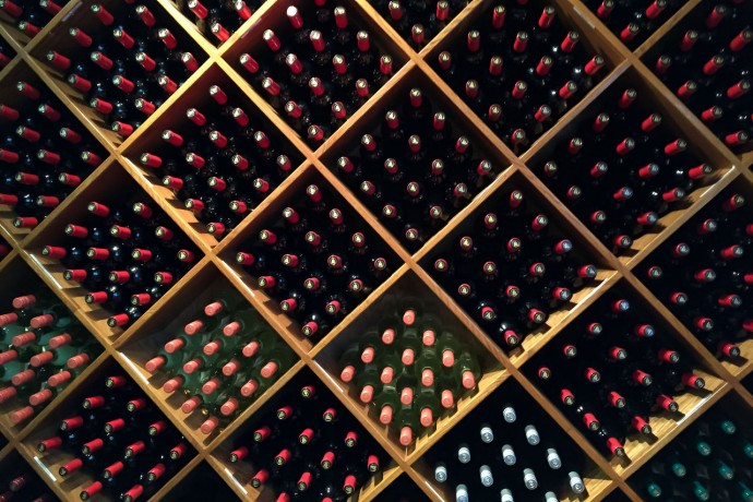 Close-up of stacked wine bottles in a shop