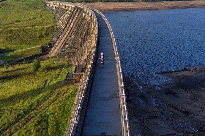 Aerial view of cyclist crossing baitings dam