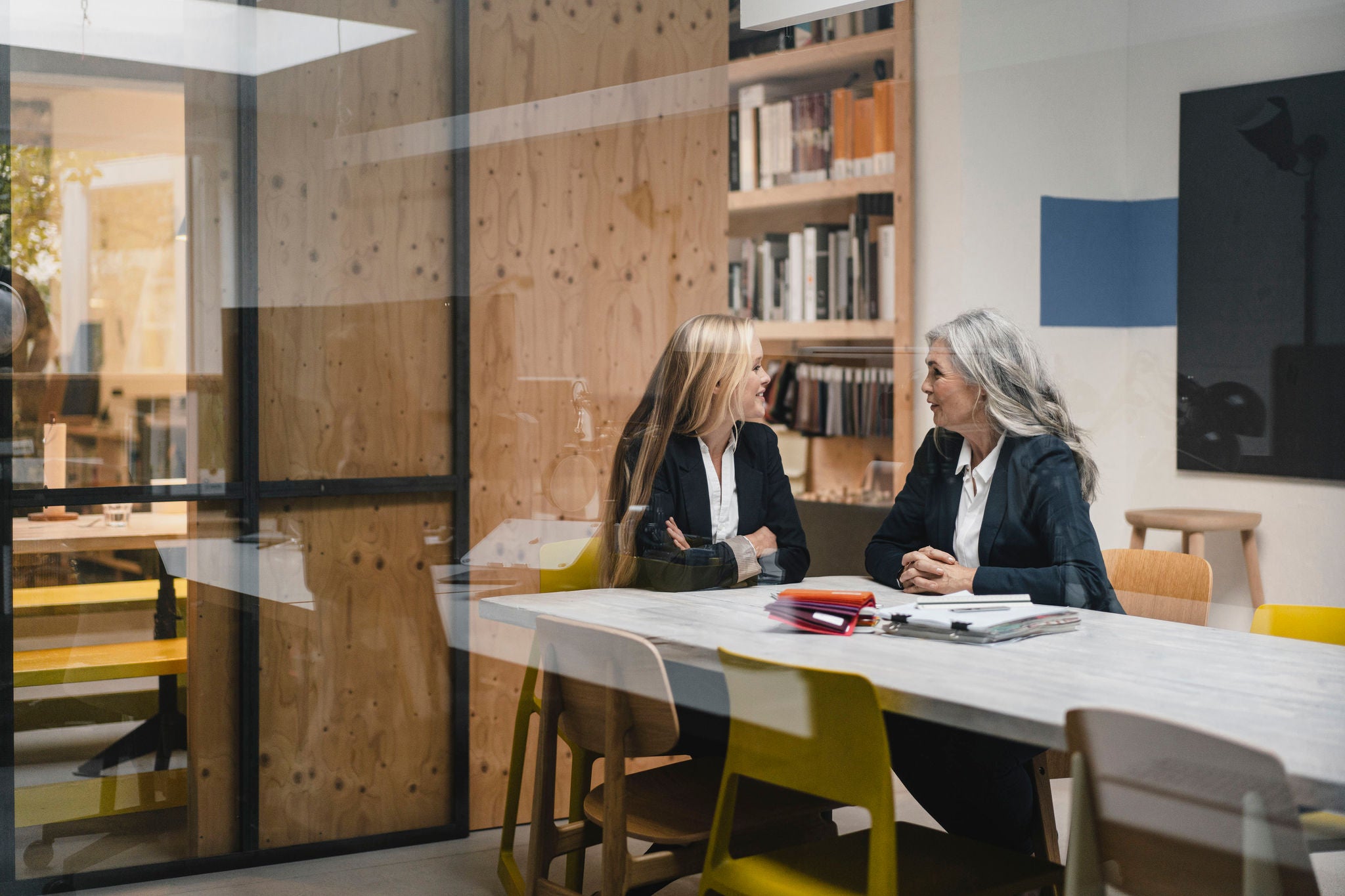 Mother and daughter business team in office