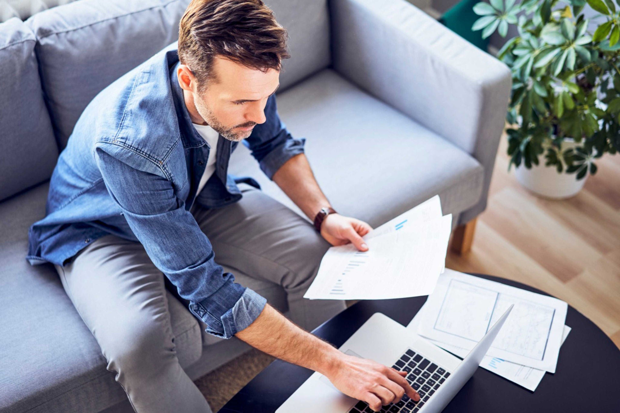 Man entering data into laptop