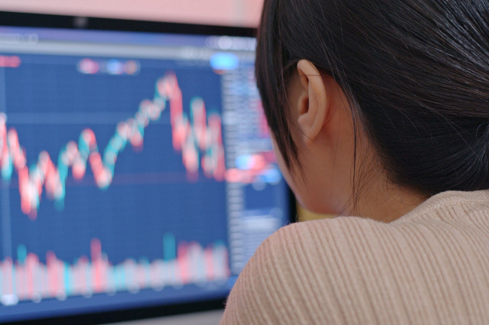 Woman looking at data on screen