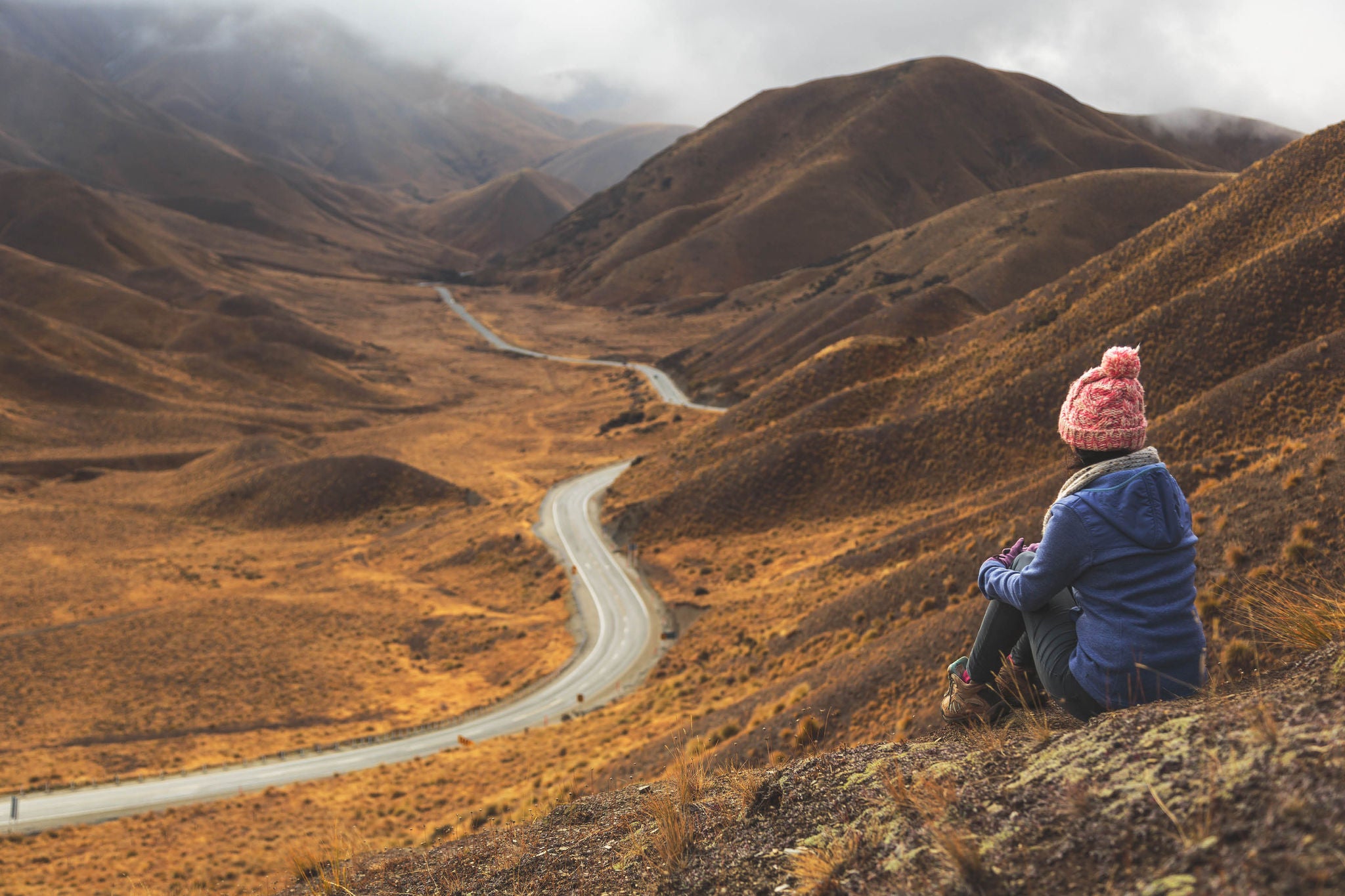 Woman sitting in mountain