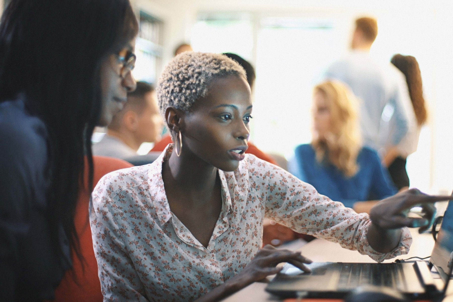 Two women working at computer