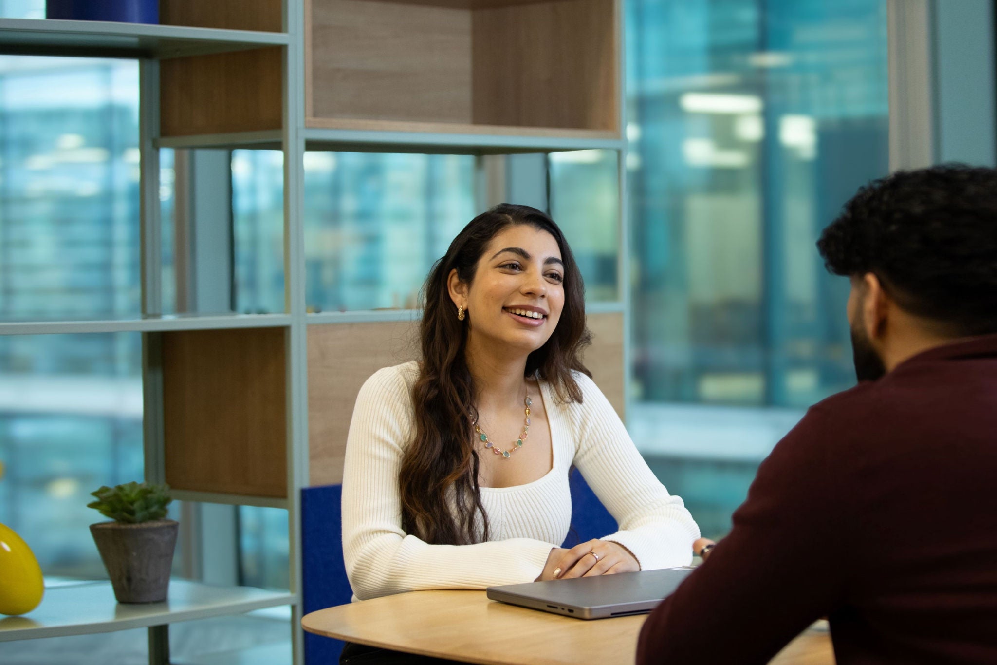 EY navya sitting in an EY office