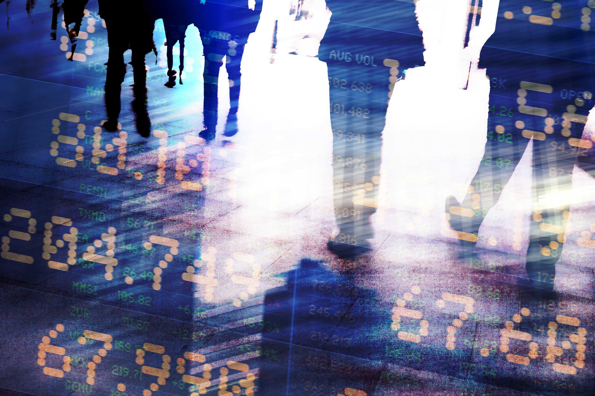 Abstract image of traders in financial district with trading screen data, light reflections and blurred movement.