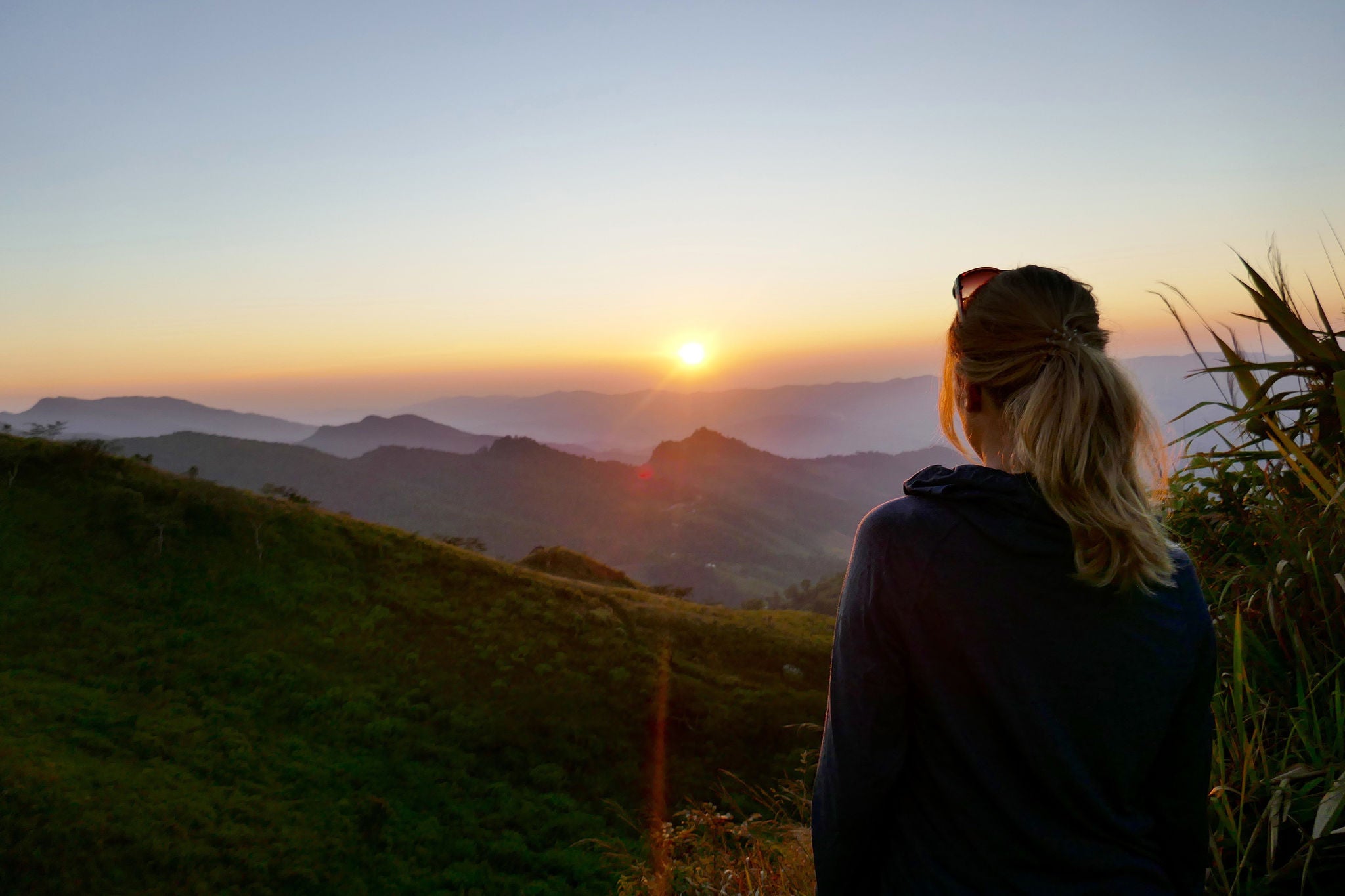 Woman looking at the sun rise