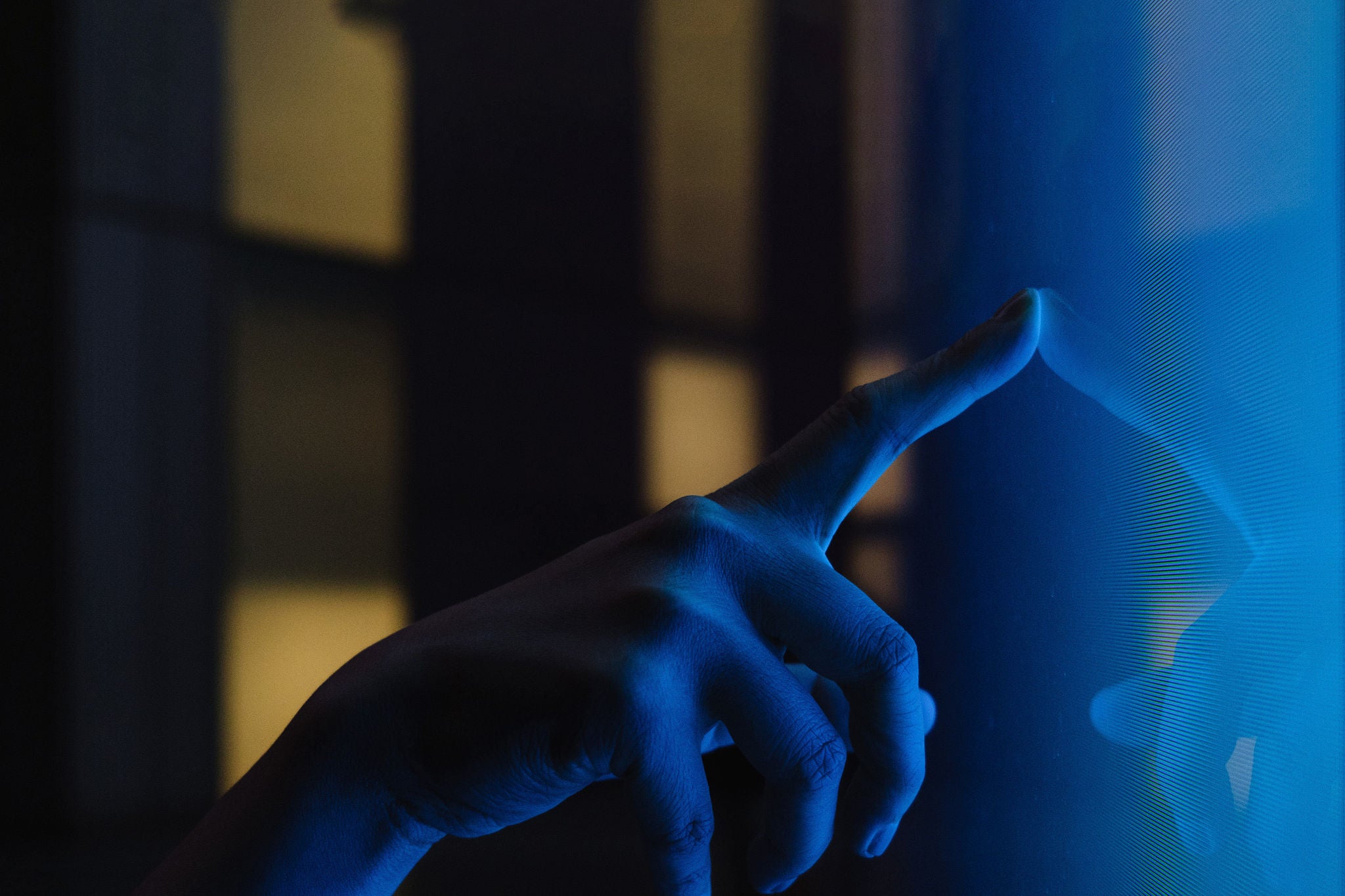 Close up view of woman hand using interactive touchscreen display of electronic kiosk