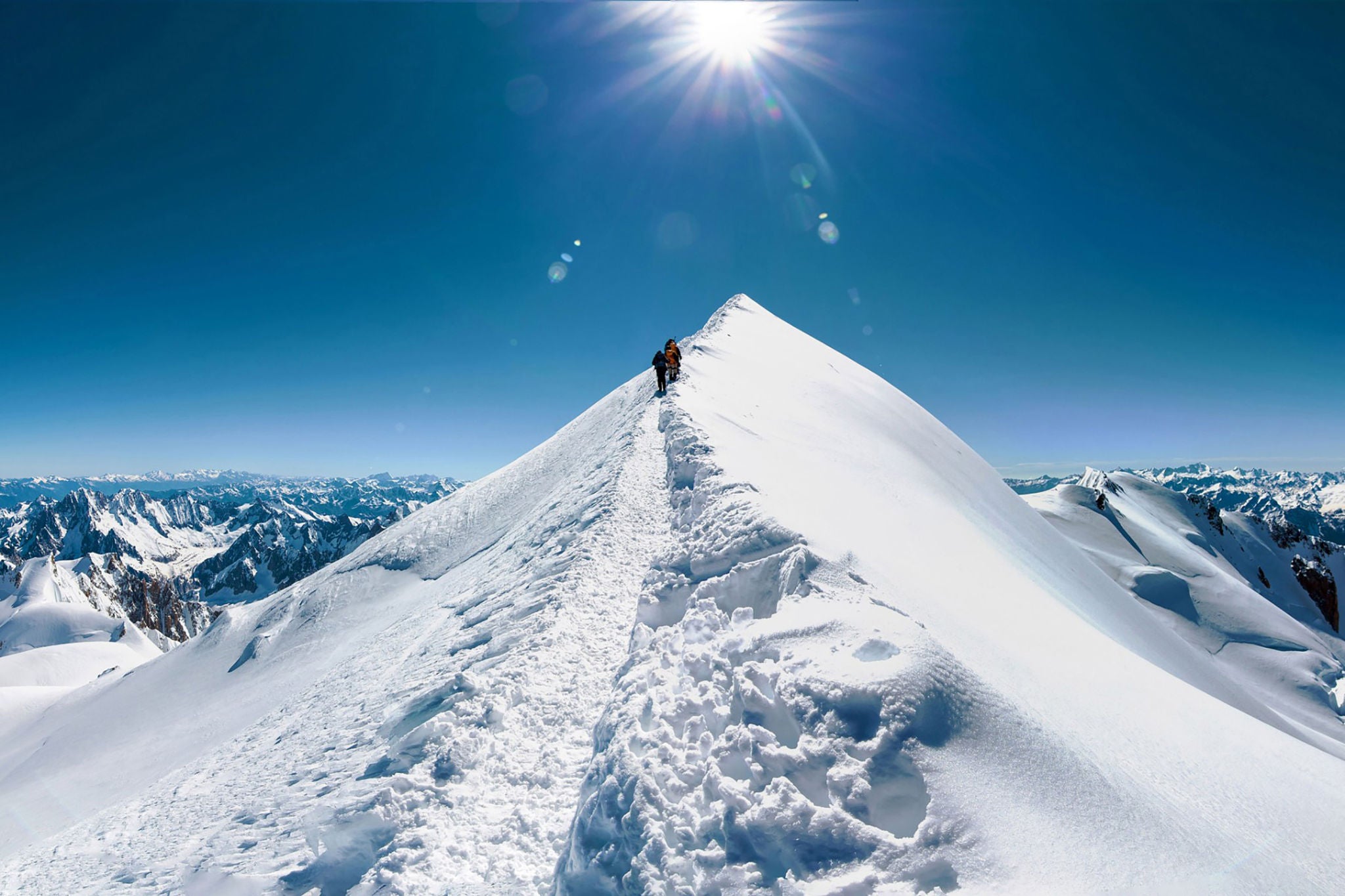 climbers approach mountain top