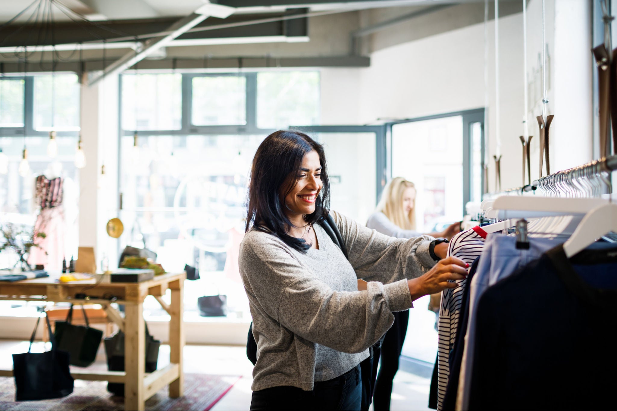 Woman browsing clothes on rack