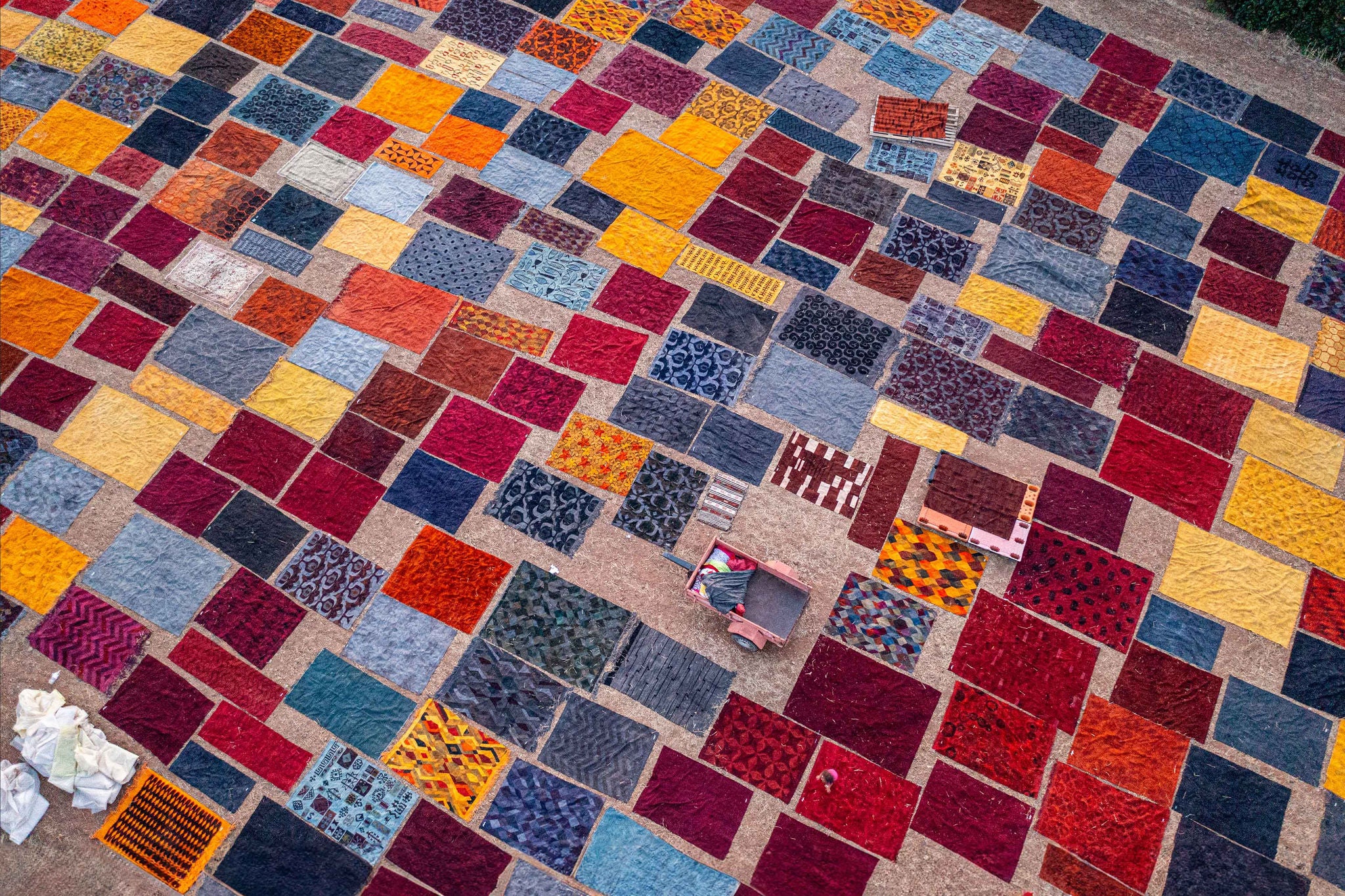 Aerial view of many carpets on field