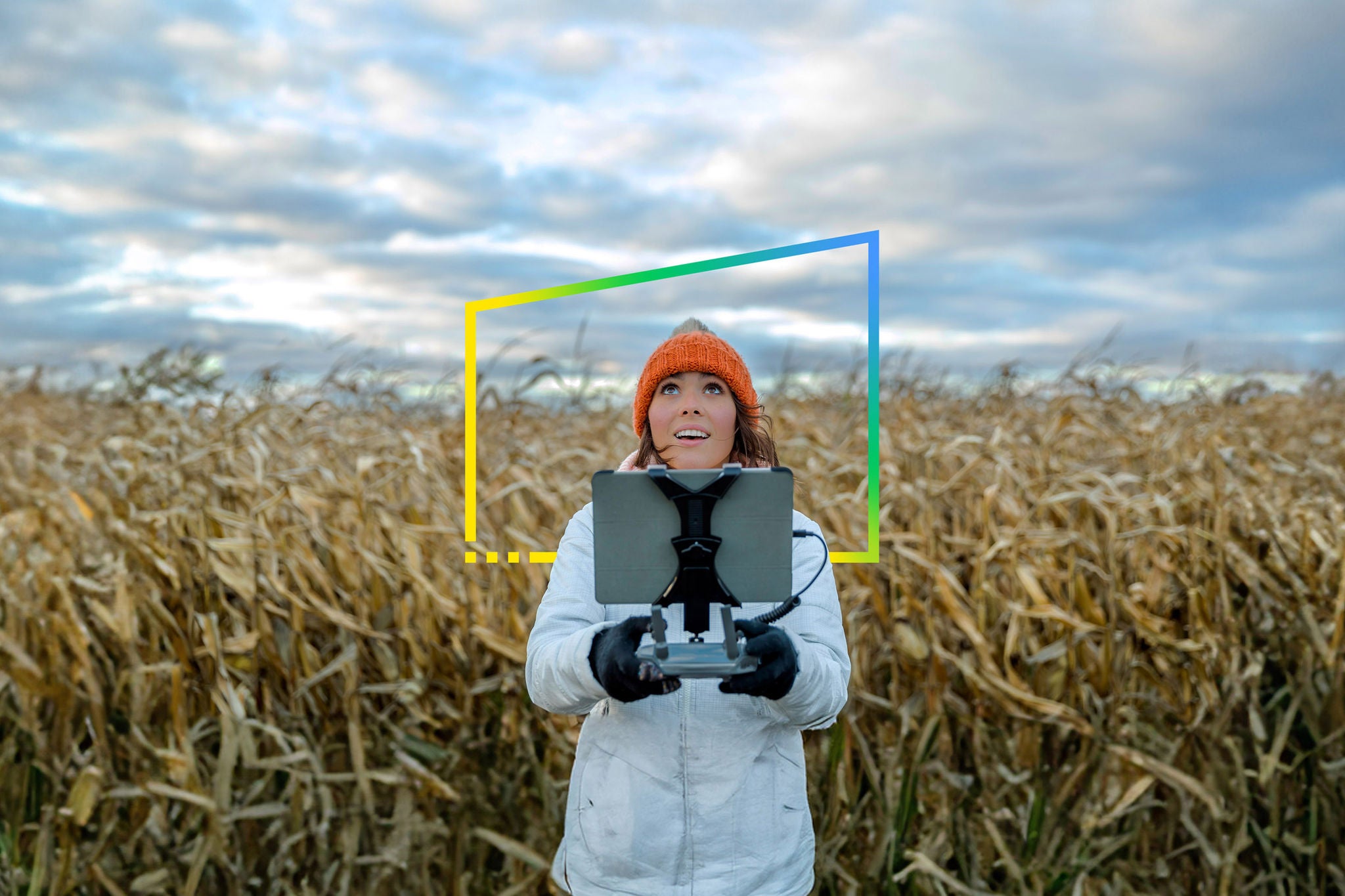 Young lady operating the drone in farm