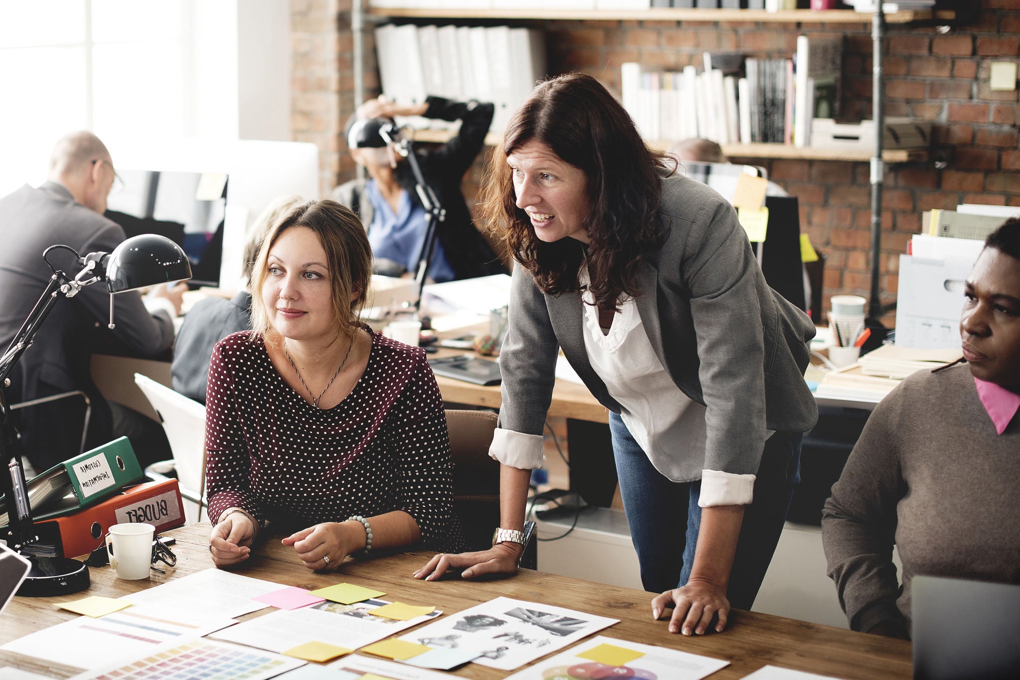 People working together with papers on table