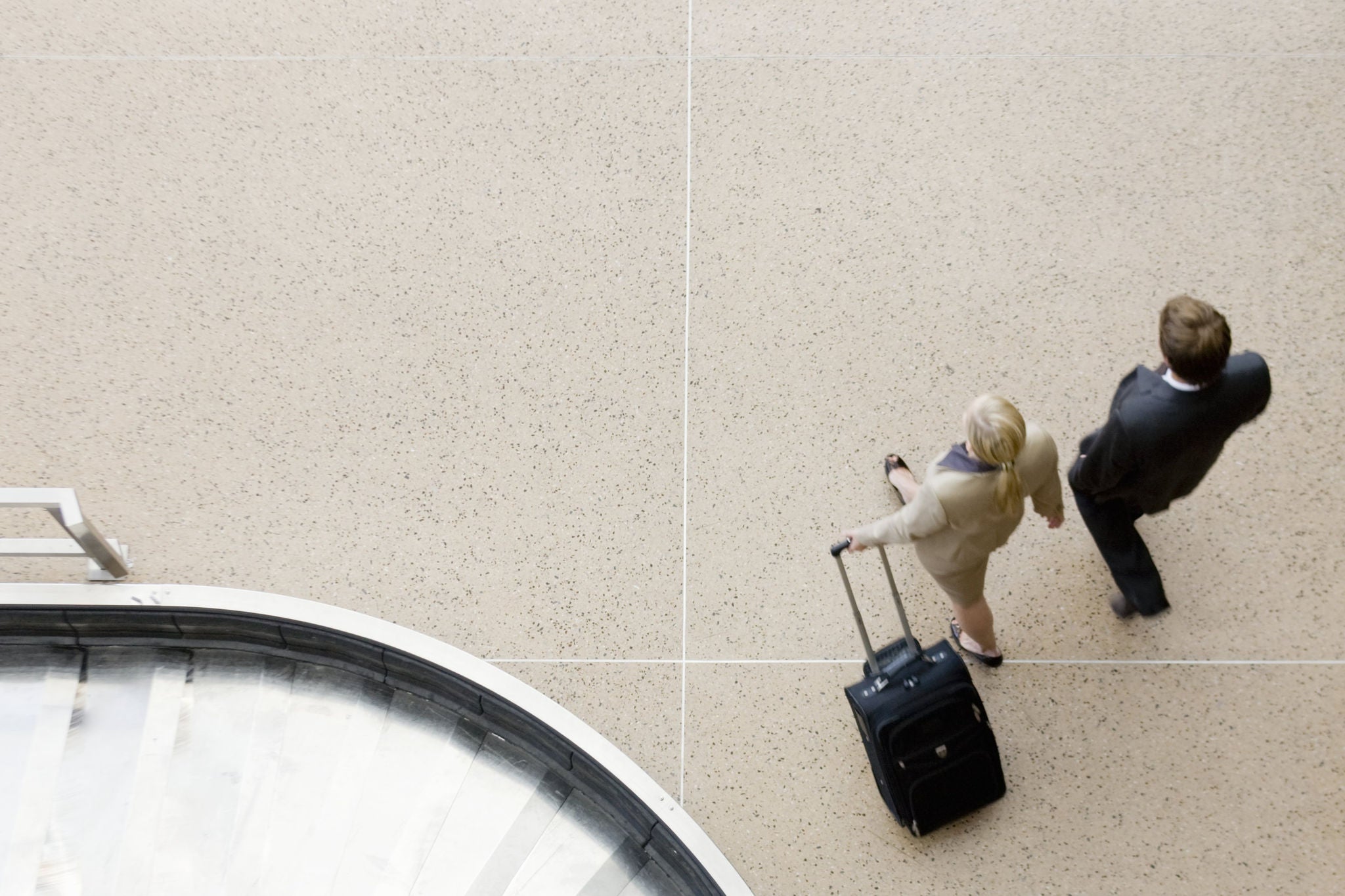 Drone shot of two business people walking