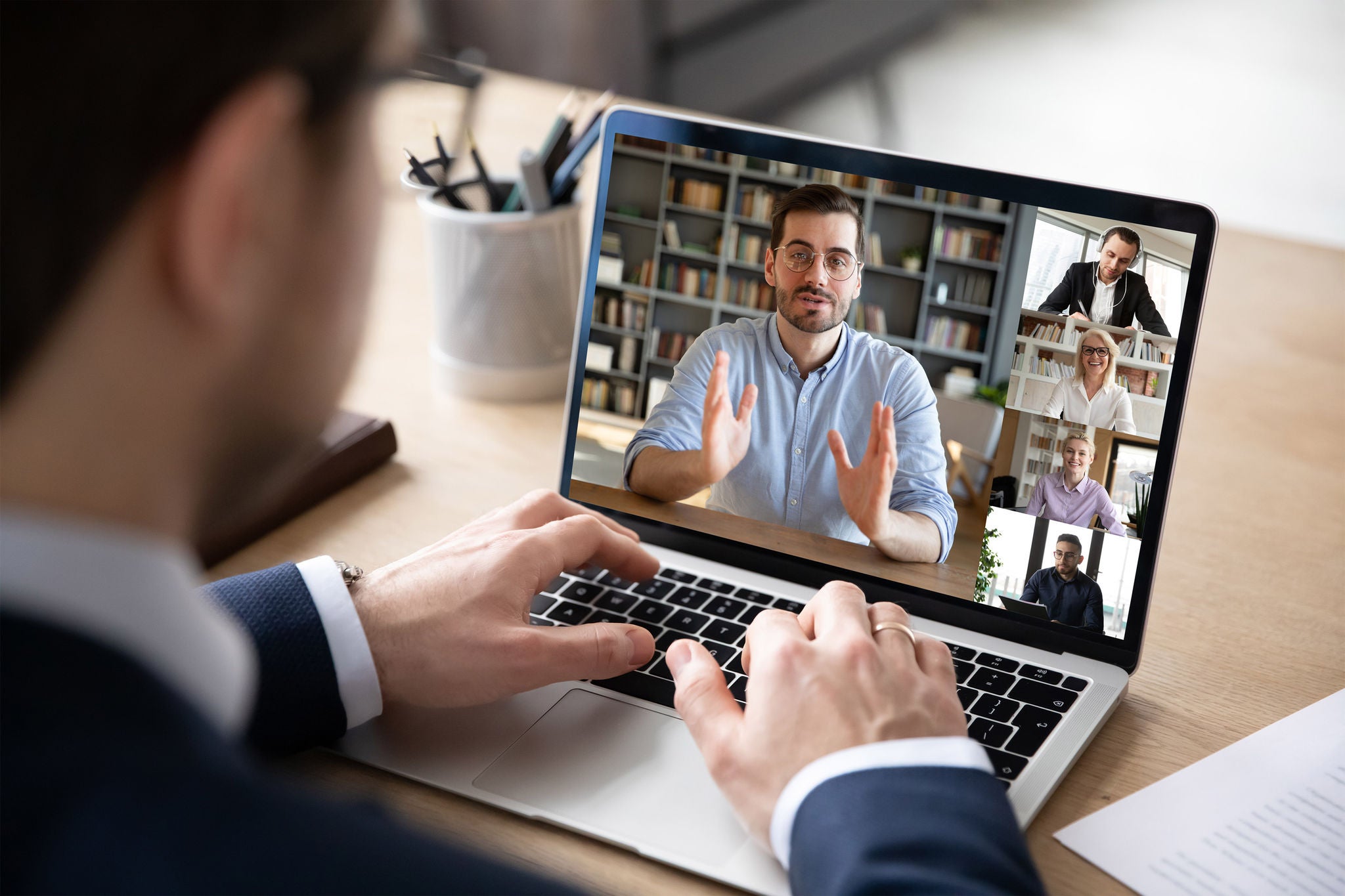 Employees are discussing in video call