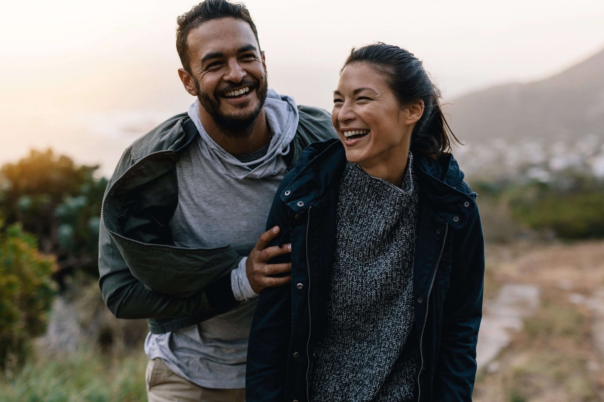 EY - Man and woman laughing together 