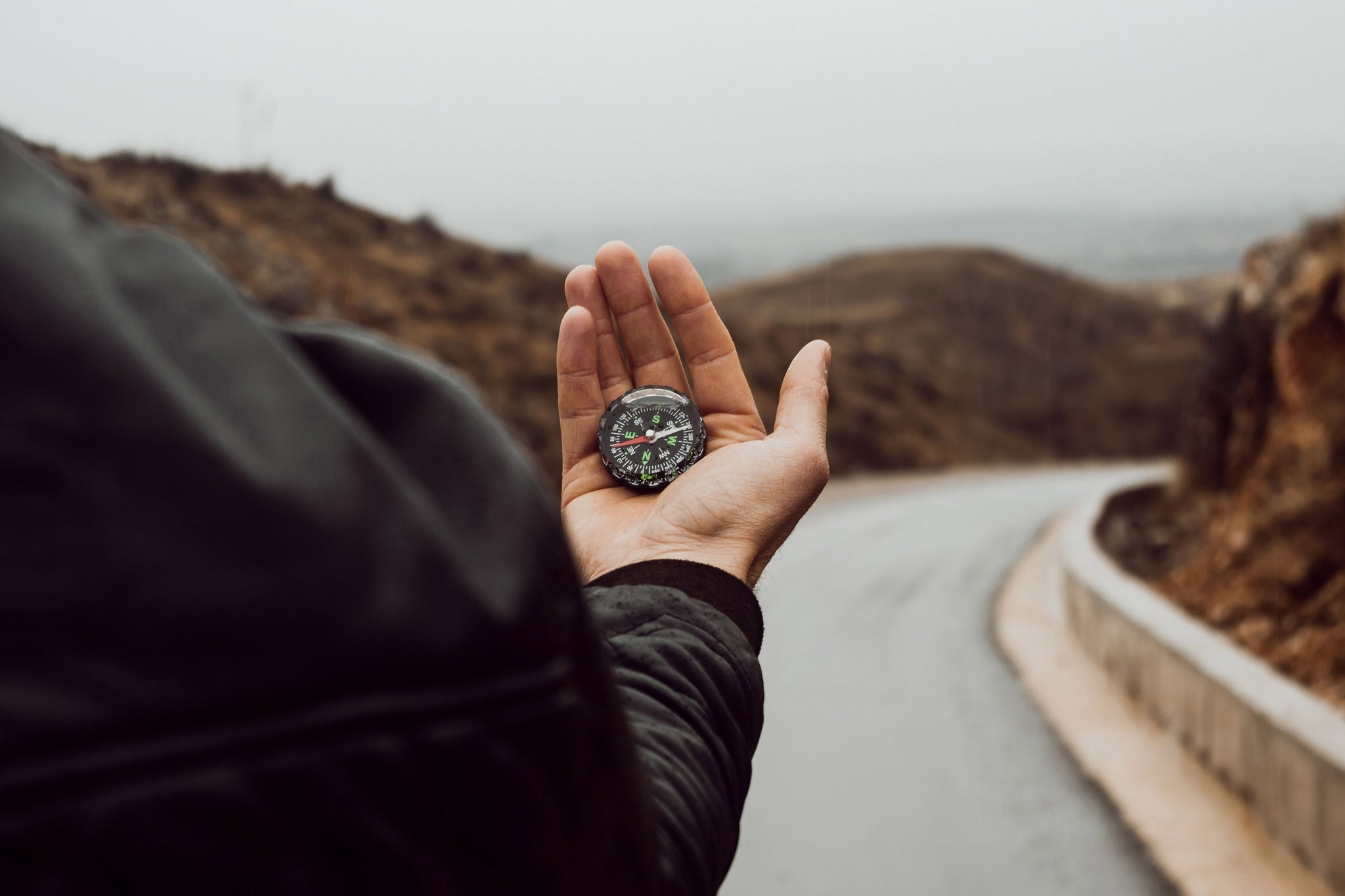 Hands holding navigational compass