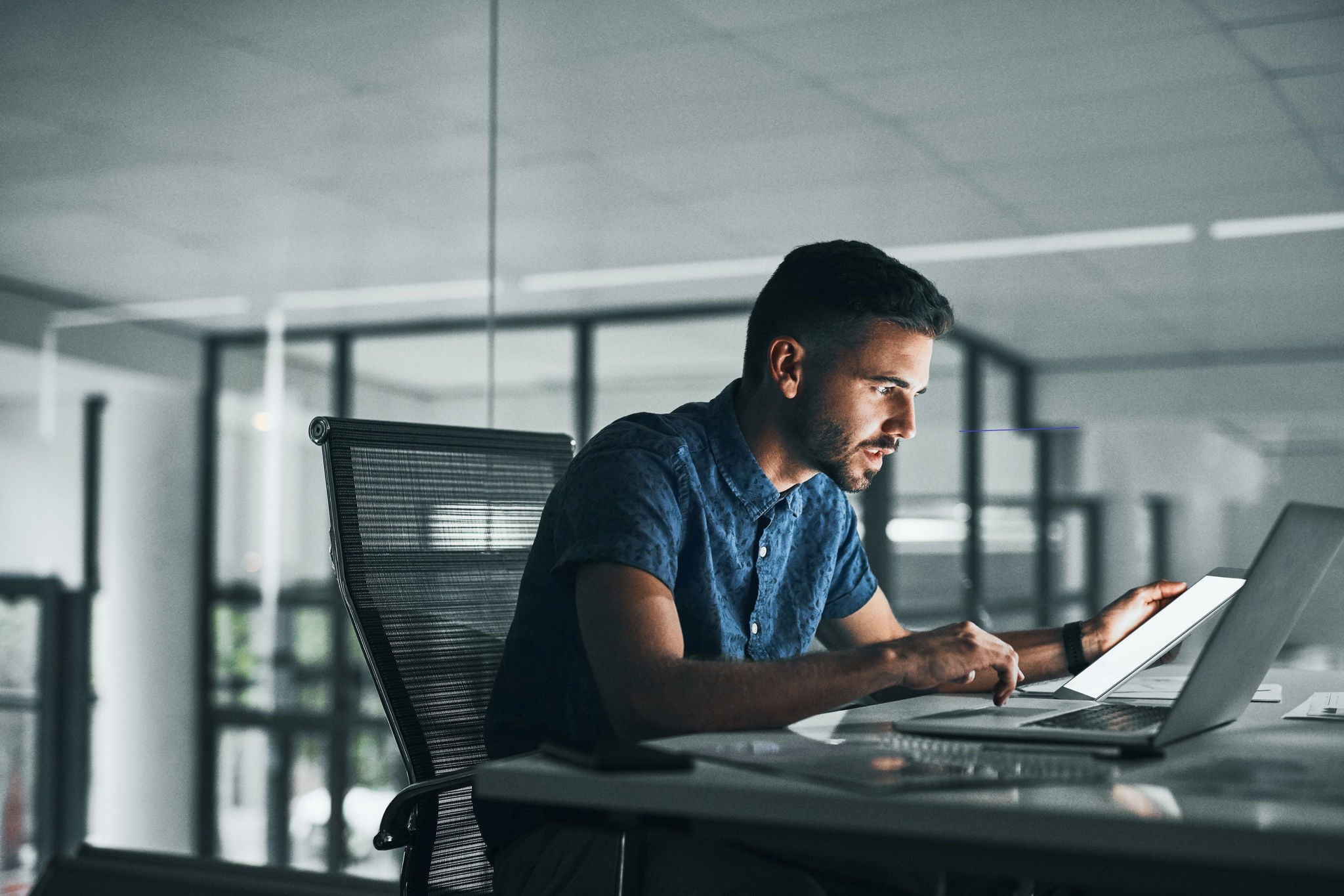 Man working on laptop in office