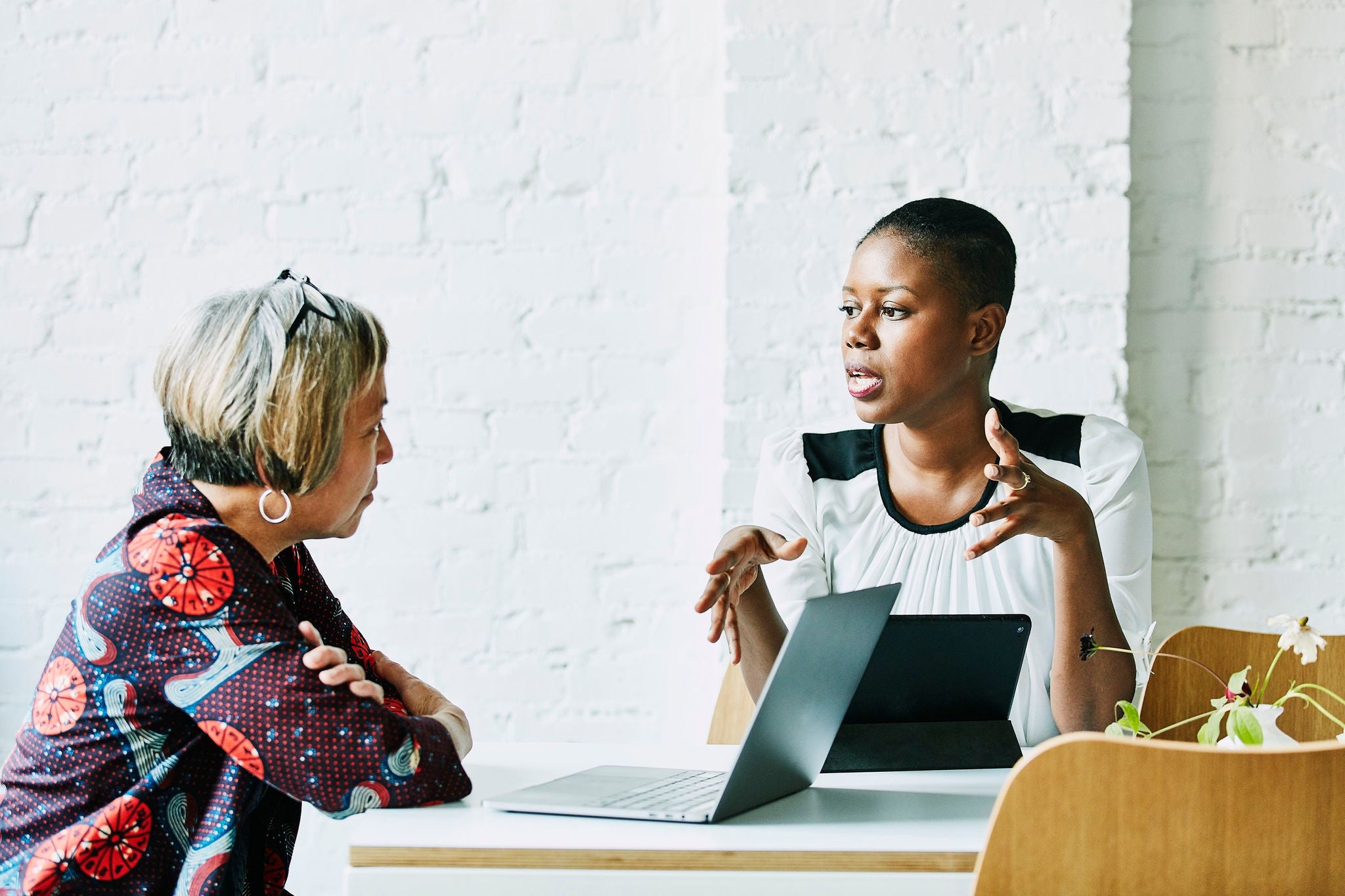 Female professionals in discussion at conference room