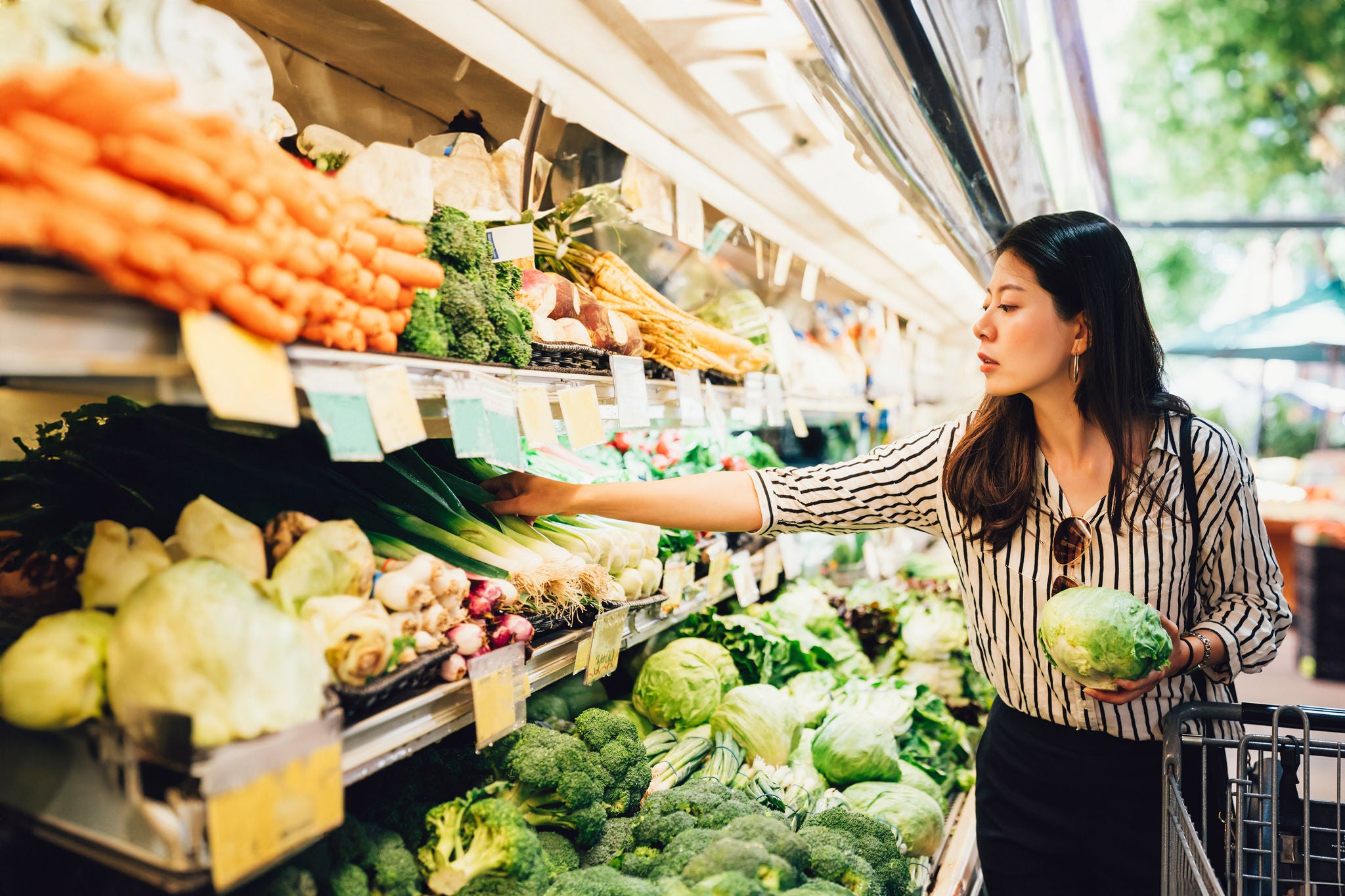 A woman grocery shopping