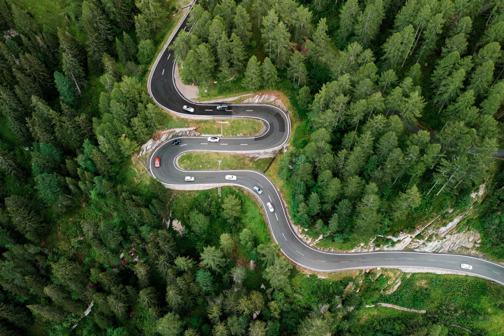 Aerial view of car on the mountain road in Switzerland