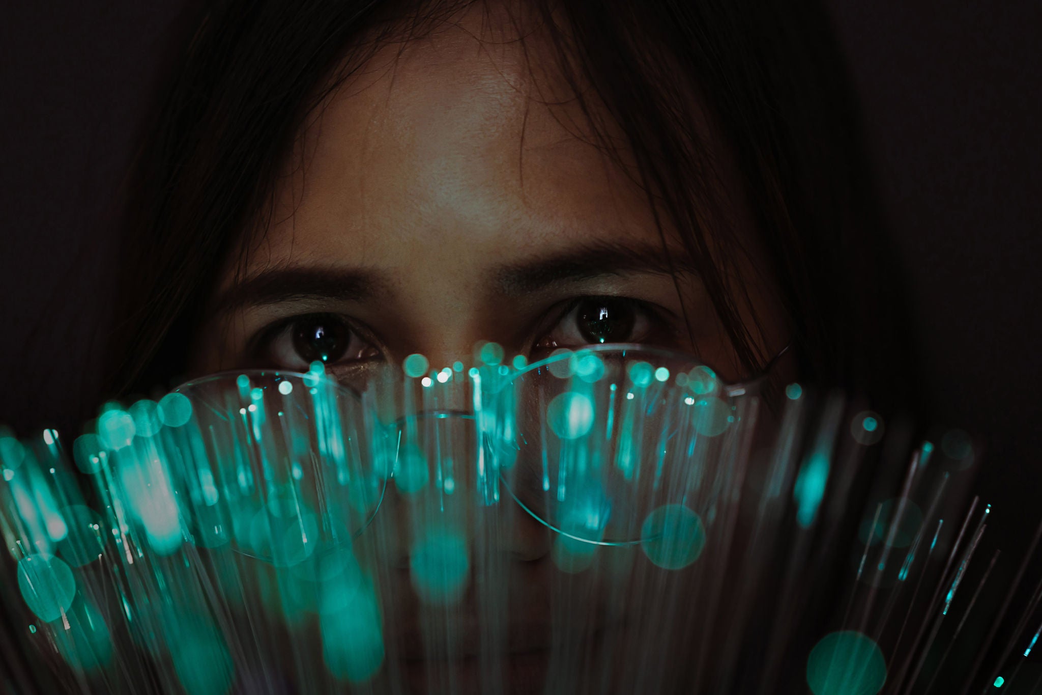 Close-up portrait of girl with illuminated lights