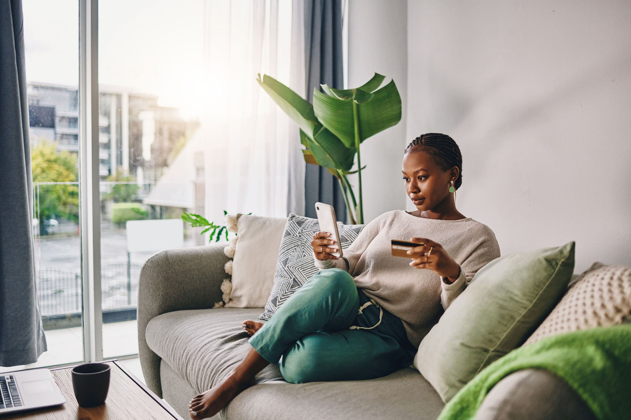 A women using phone on couch