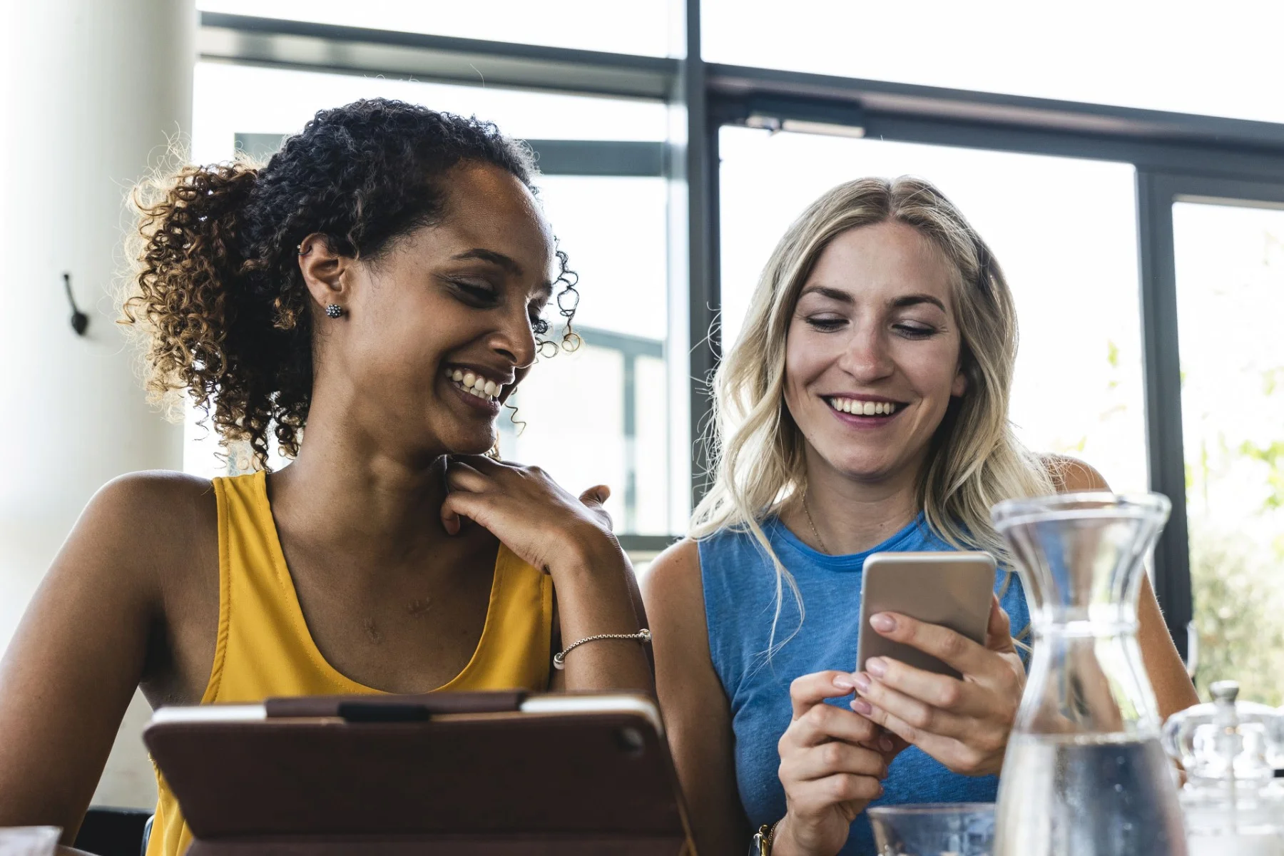 ey-woman-scrolling-through-tablet