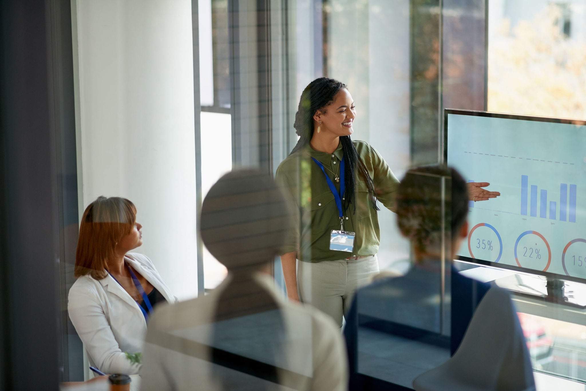  young businesswoman giving a presentation in the boardroom