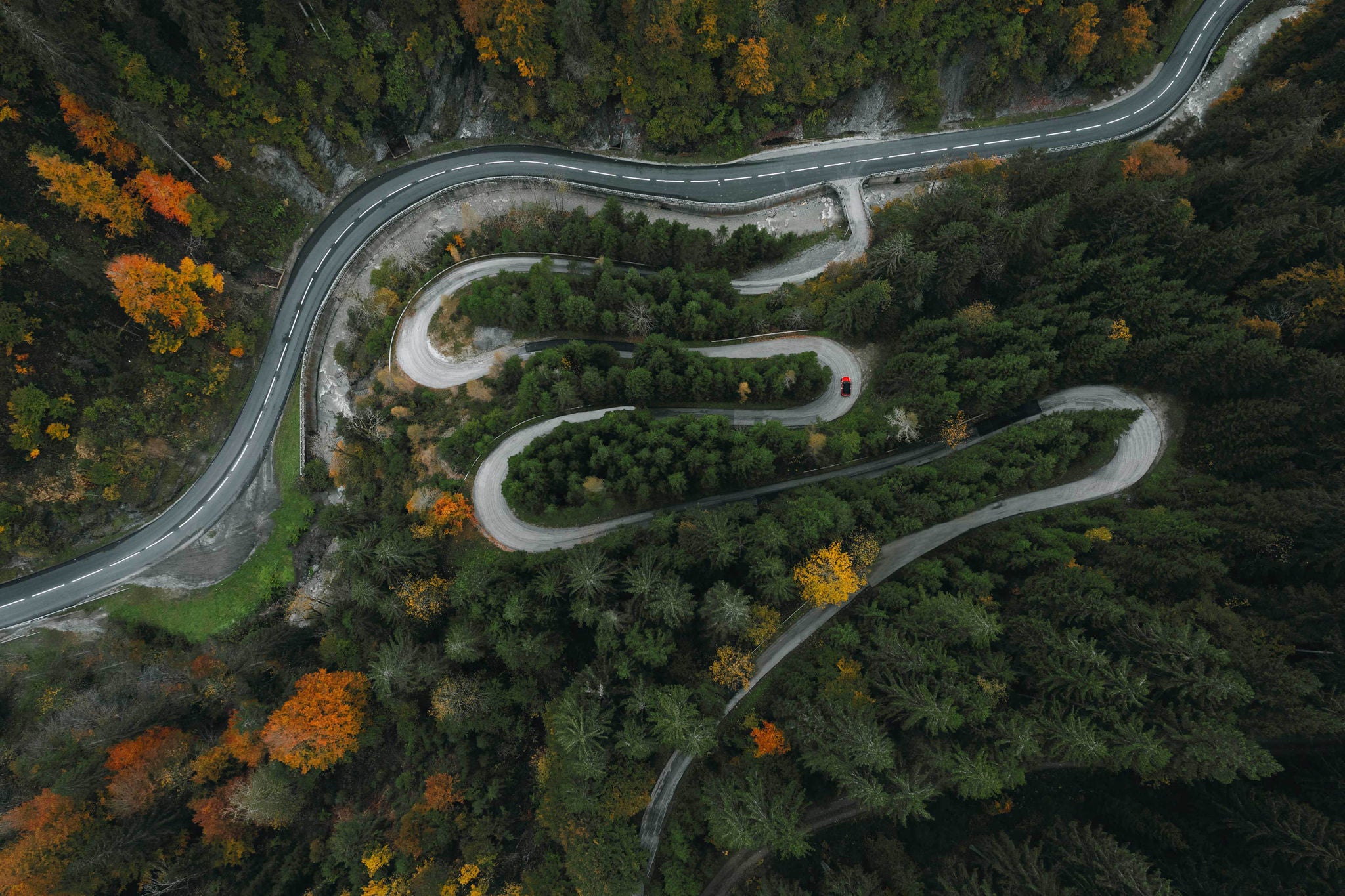 Winding roads through forest in mountains