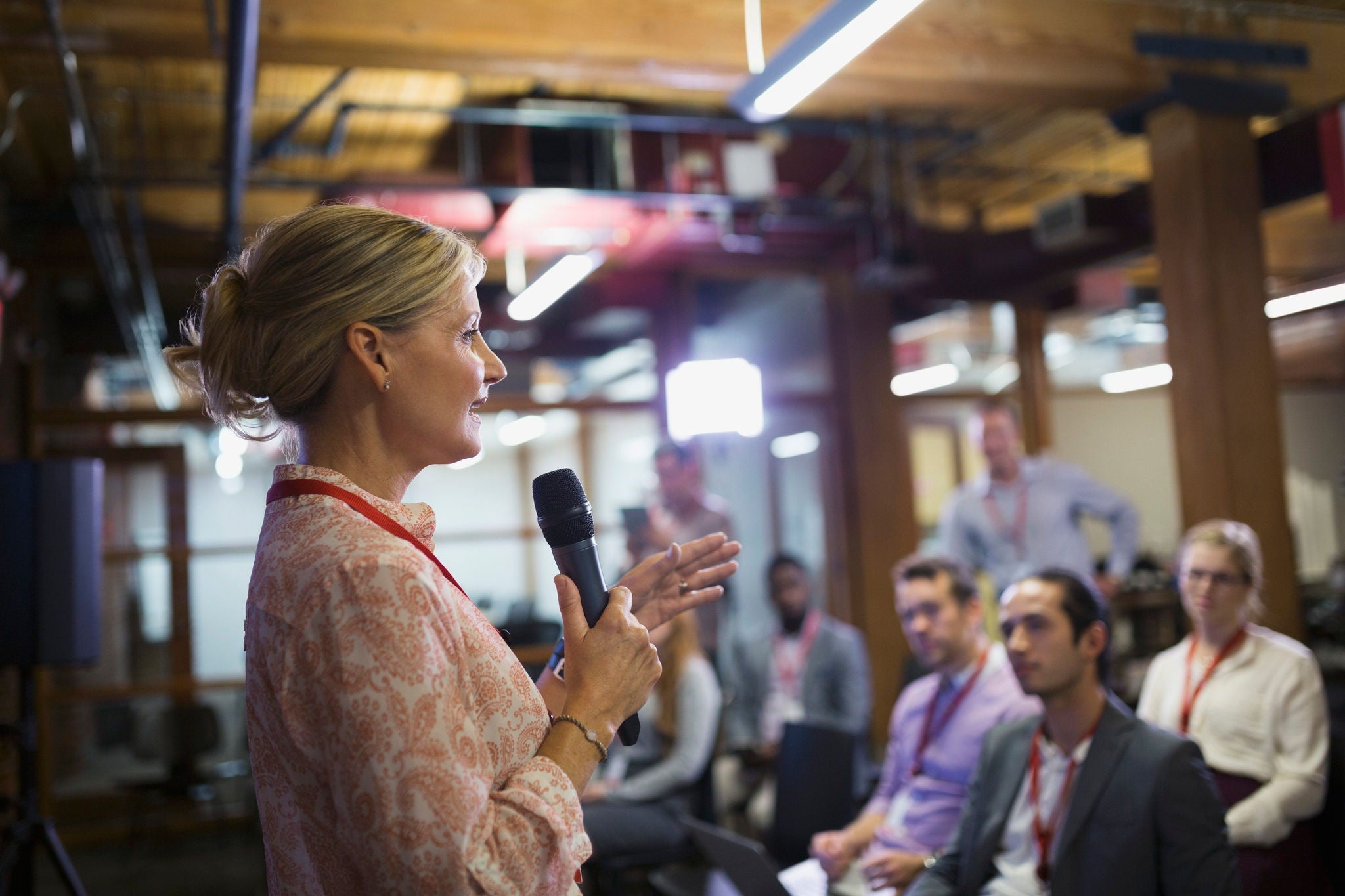 a female leader giving a speech to a group of people