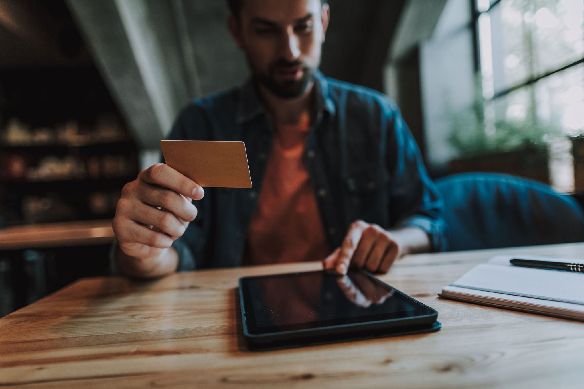 Man making a purchase on from a tablet