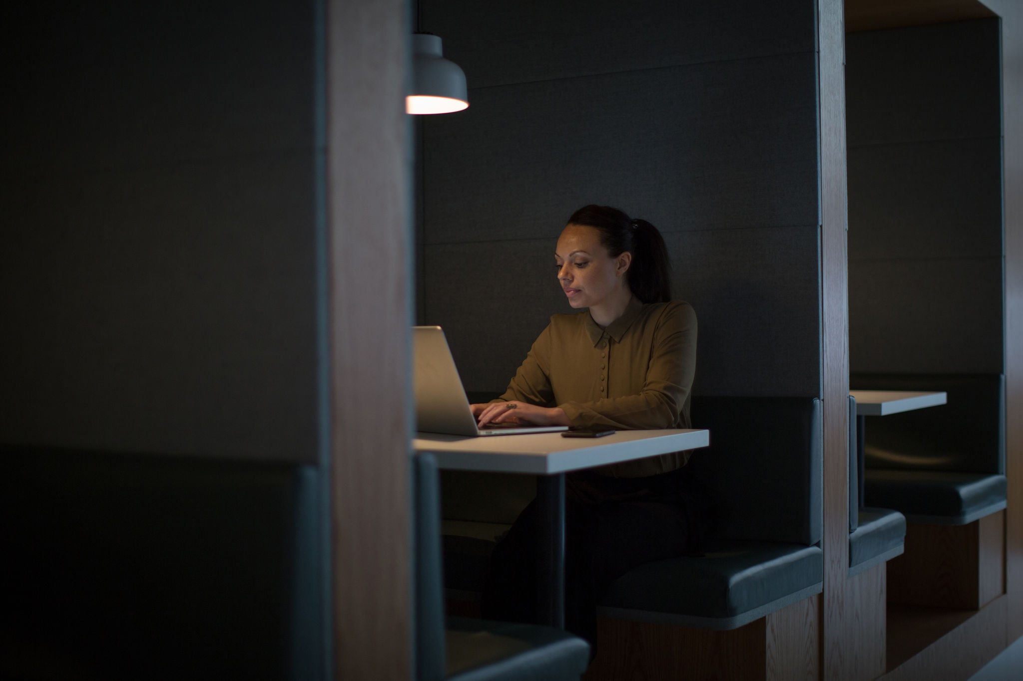 woman on laptop dark