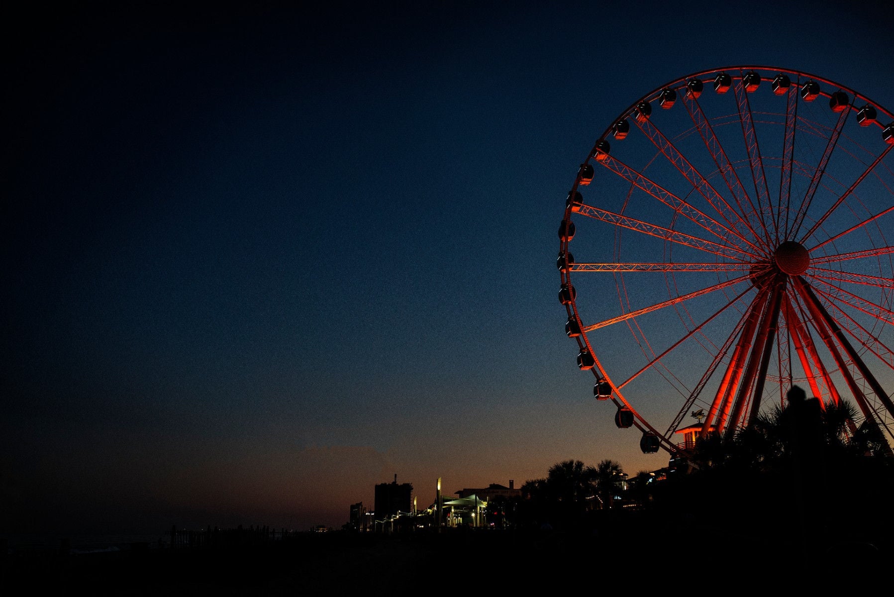 View of ferris wheel at night