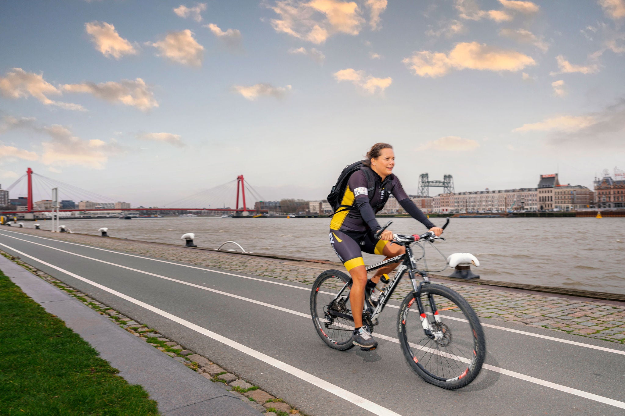 A lady is riding a cycle