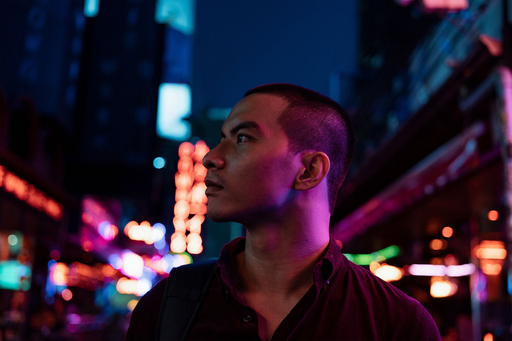 Man looking at the building standing in the center of the street