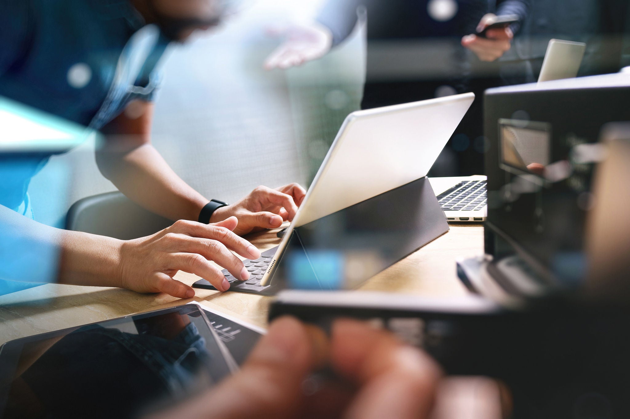 Website designer working digital tablet dock keyboard and computer laptop 