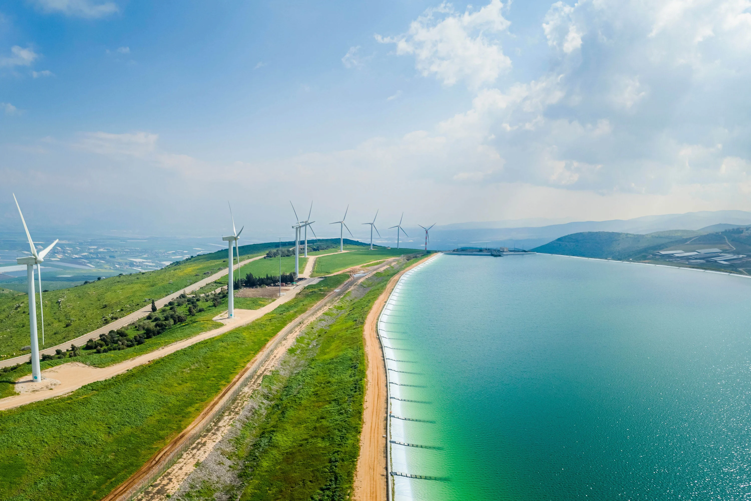 Panoramic aerial view of wind turbine and artificial lake, Mount Gilboa, Israel.