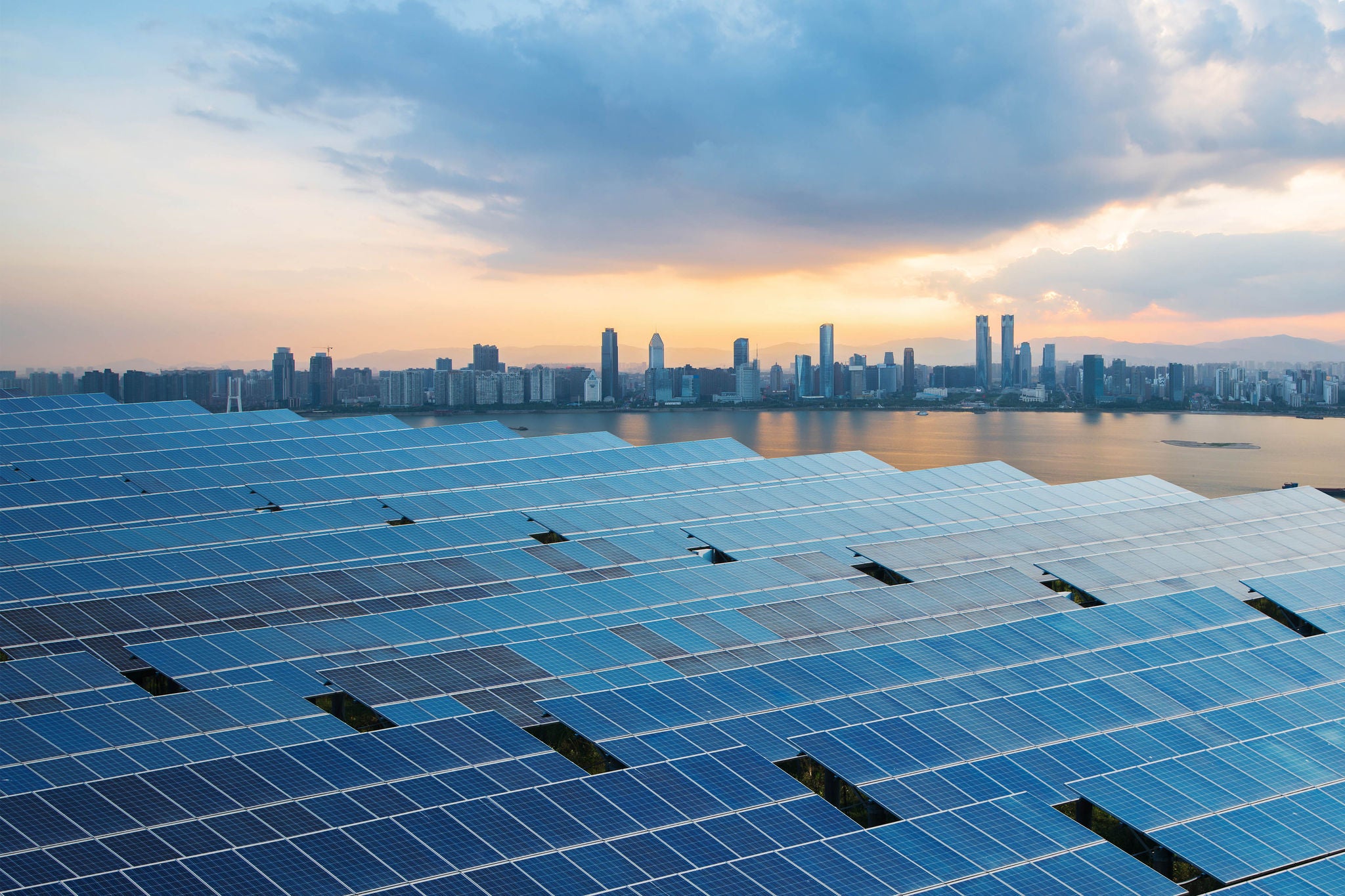 Solar panels with cityscape of singapore
