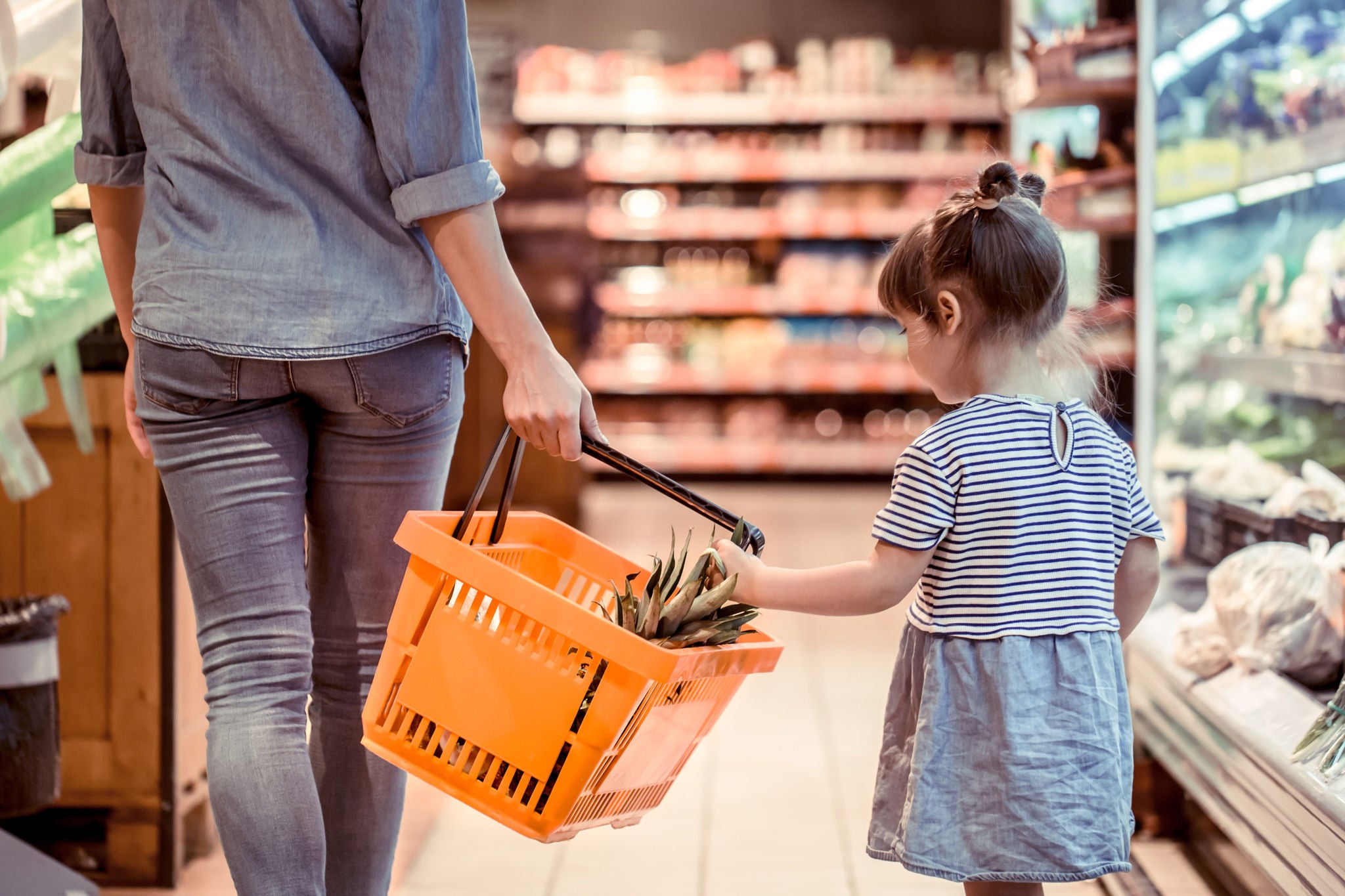 Mom and daughter are shopping at the supermarket