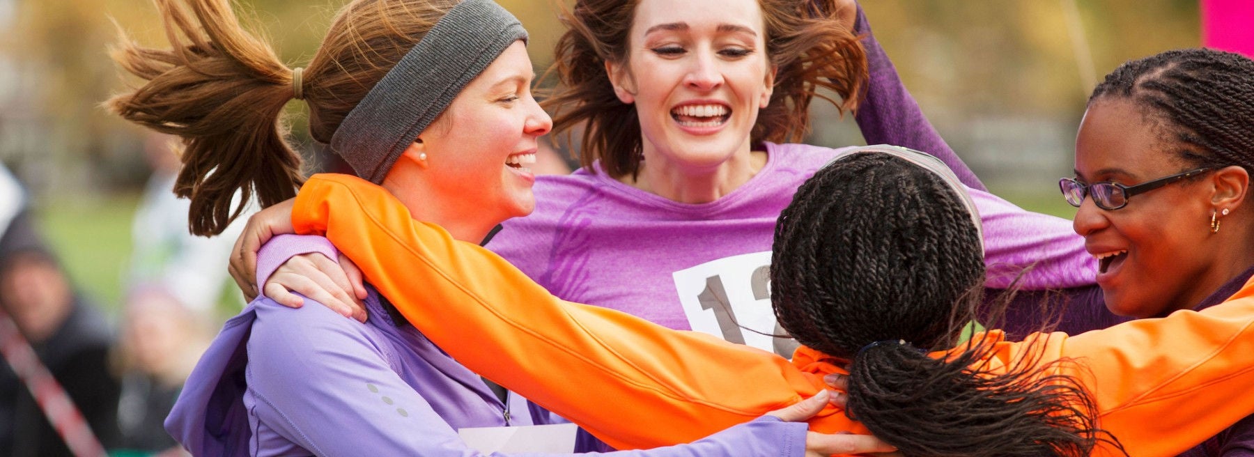 ey-female-runners-finishing-charity-run-celebrating-3840x1400