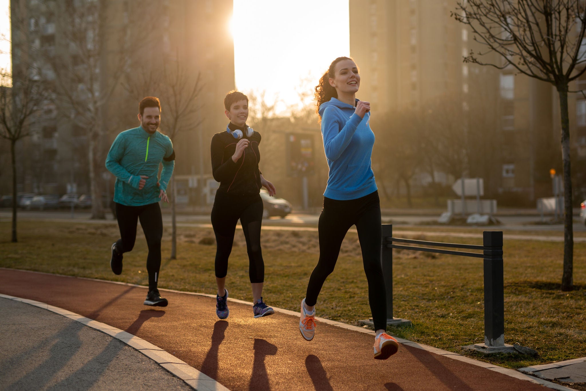  Group of sports friends people are training outdoors