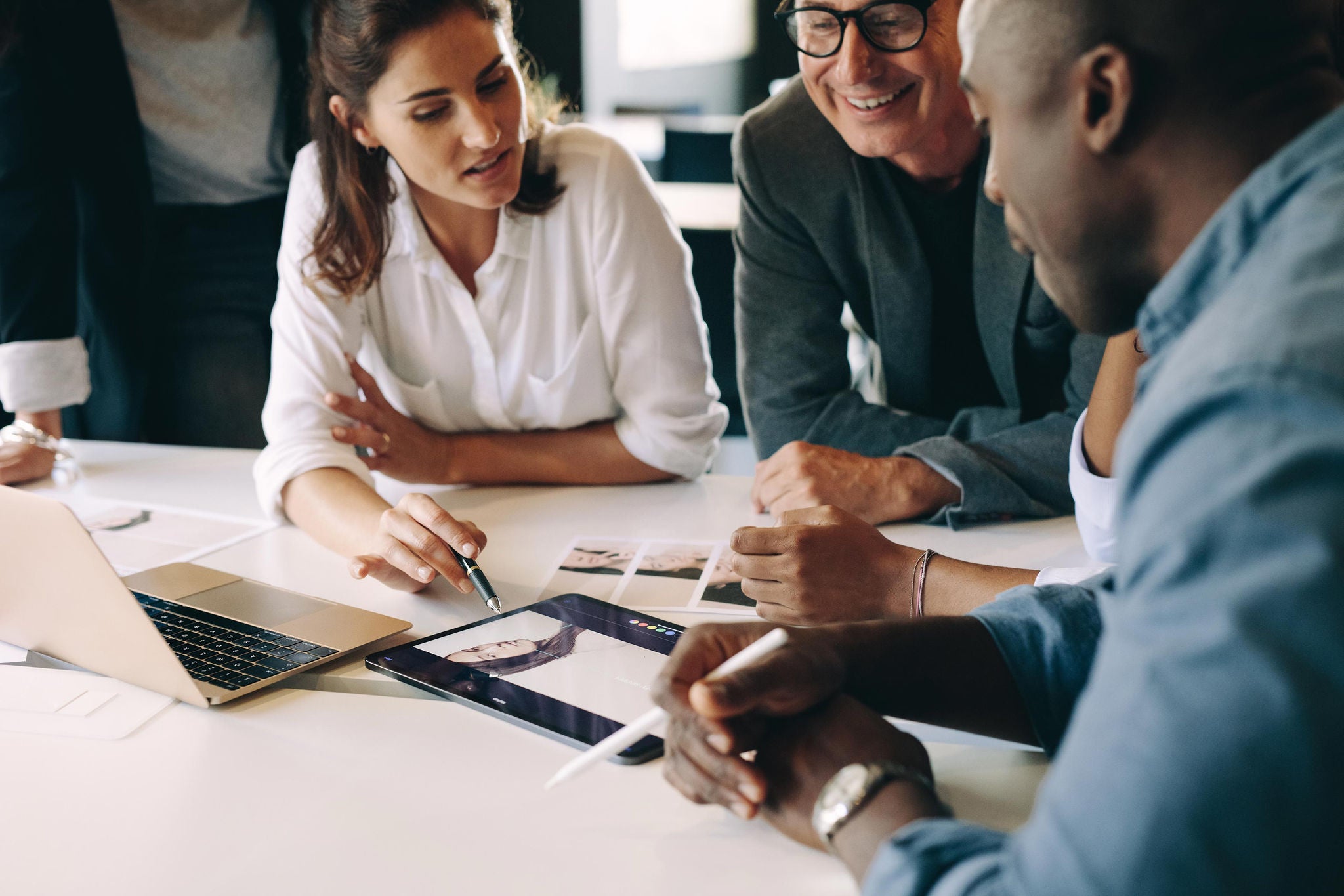 3 people discussing in office