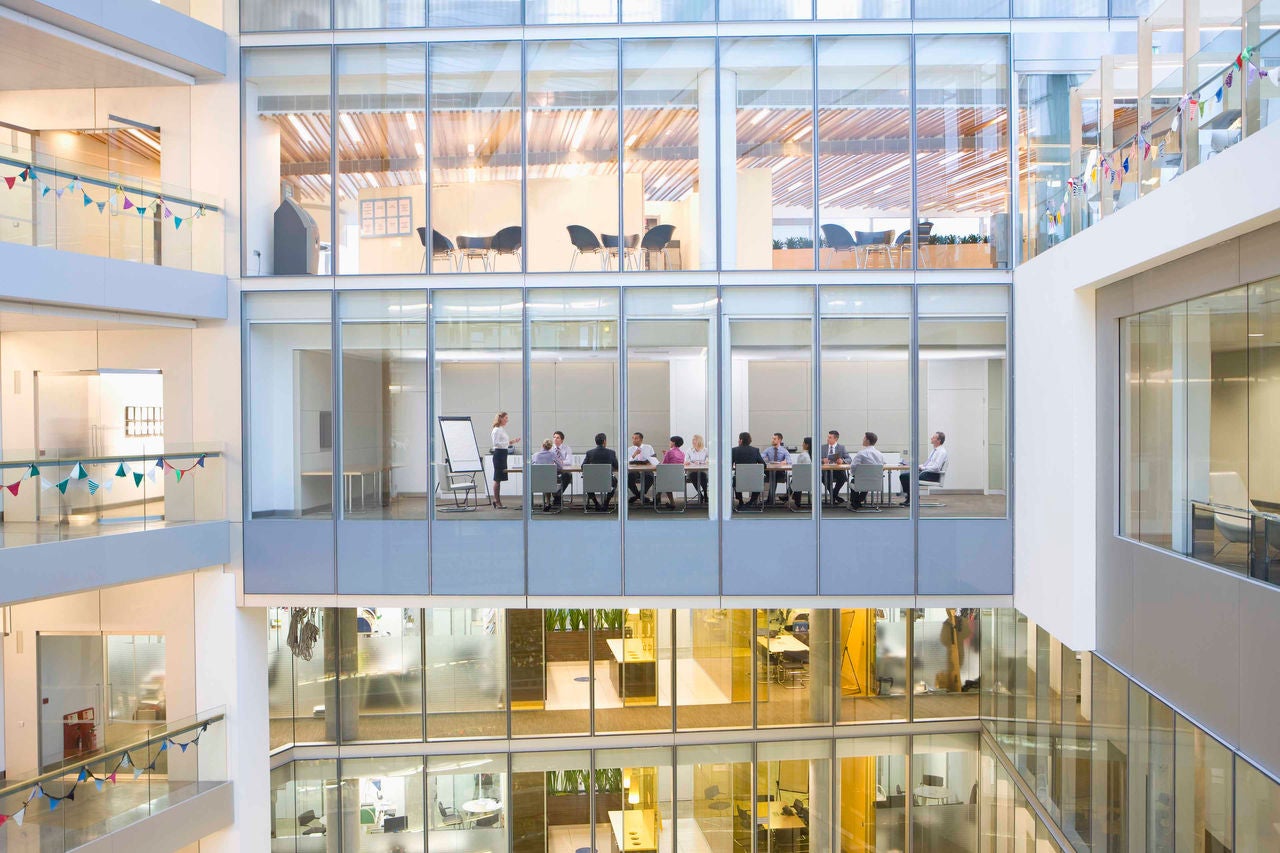 View of business people meeting in conference room of modern building