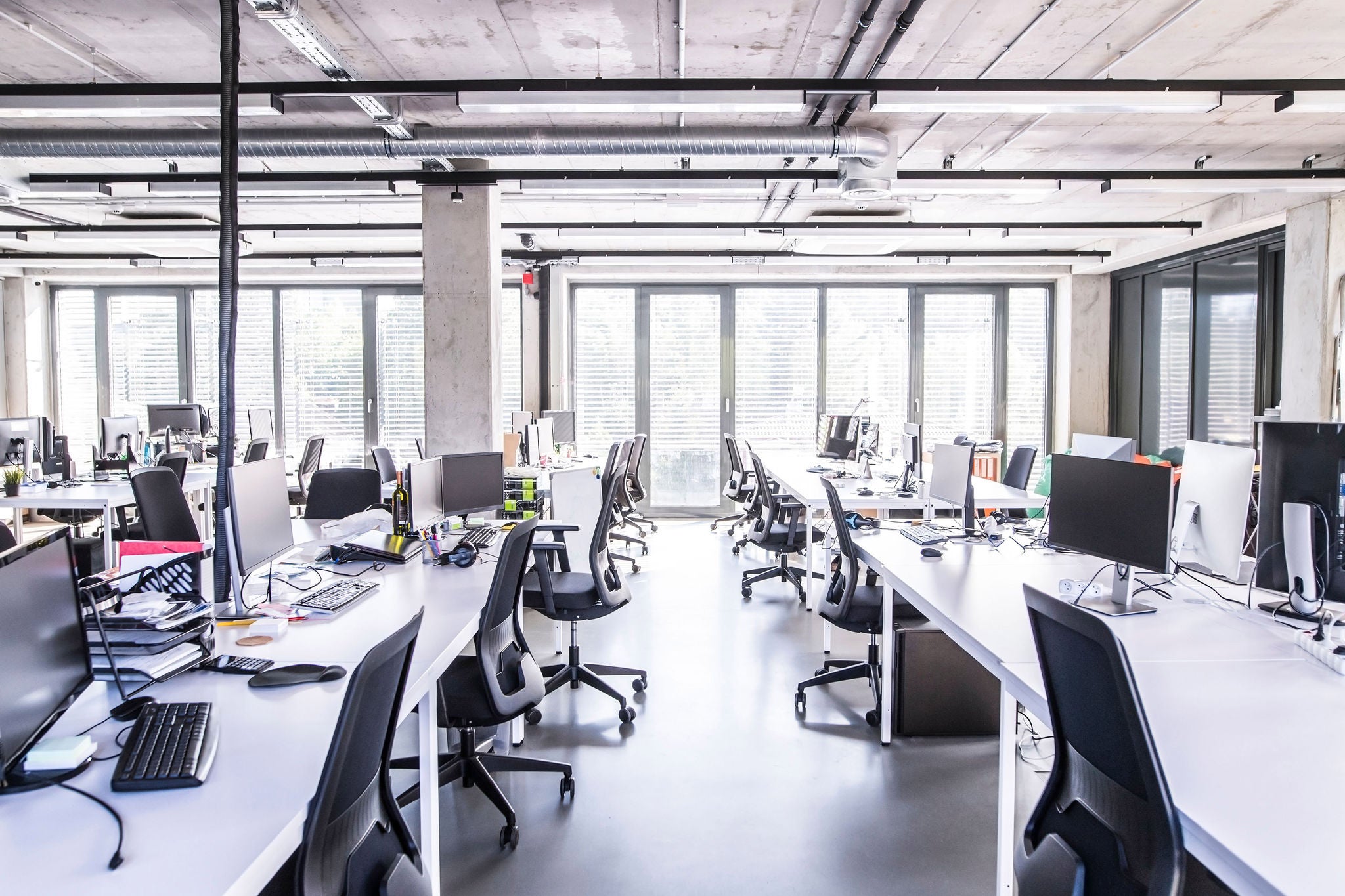 EY A view of empty chairs and desks at the office