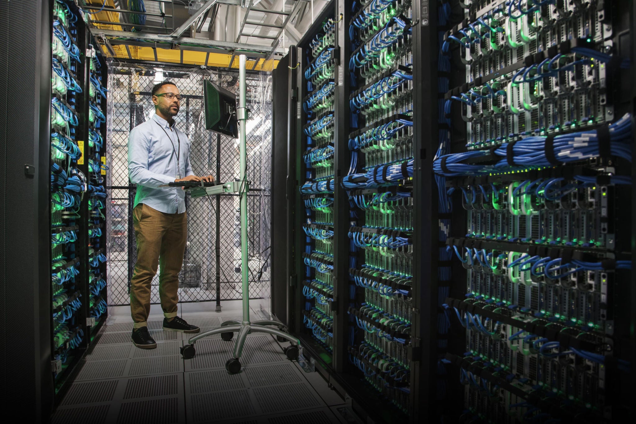 Cyber expert working in server room