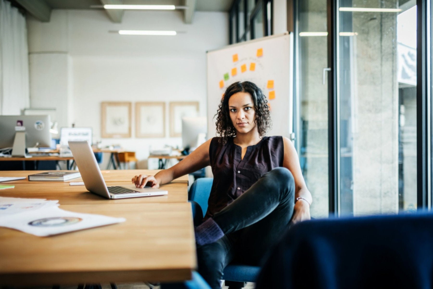 Woman with computer at desk