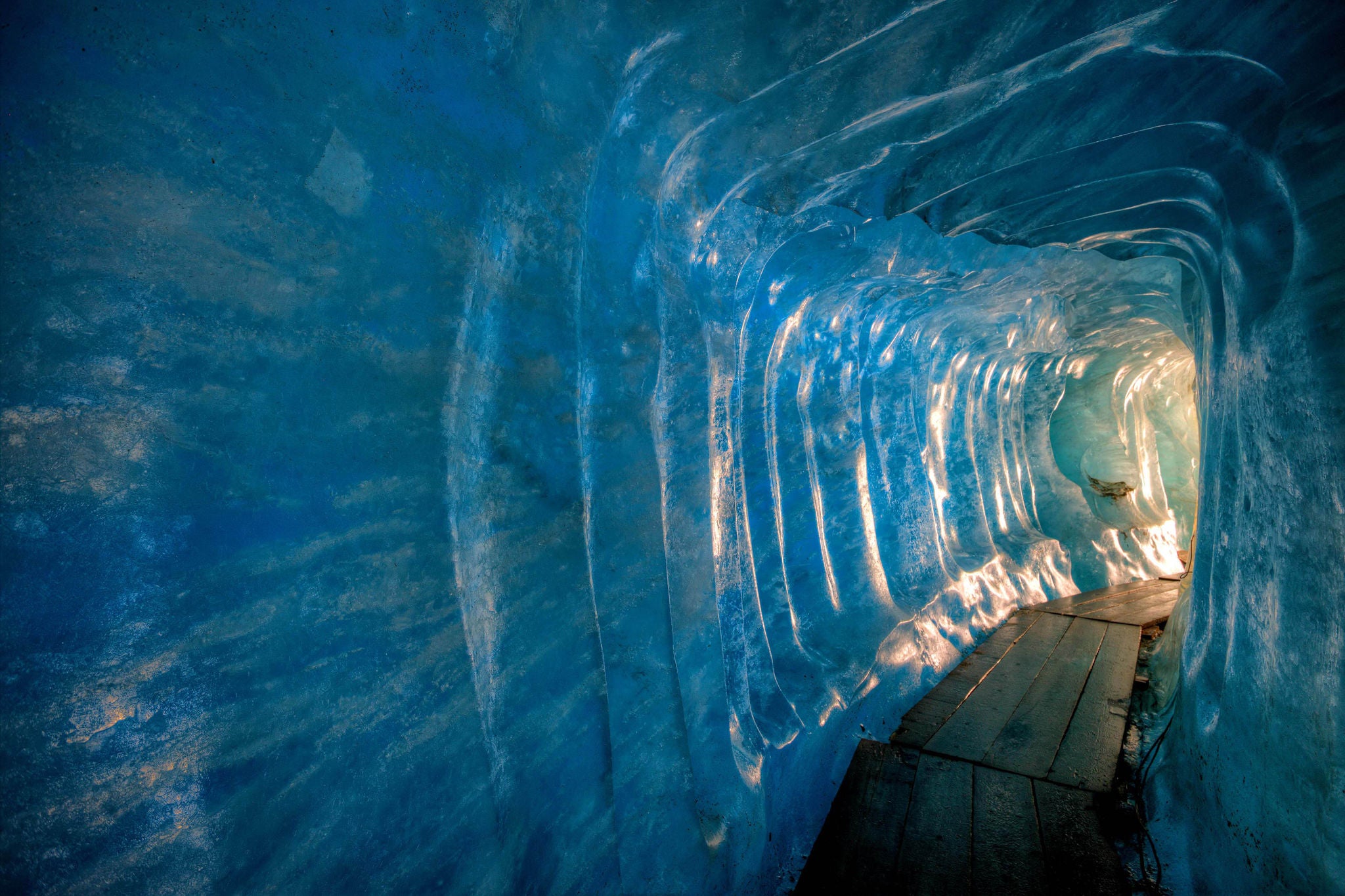 walking path inside a tunnel of frozen ice