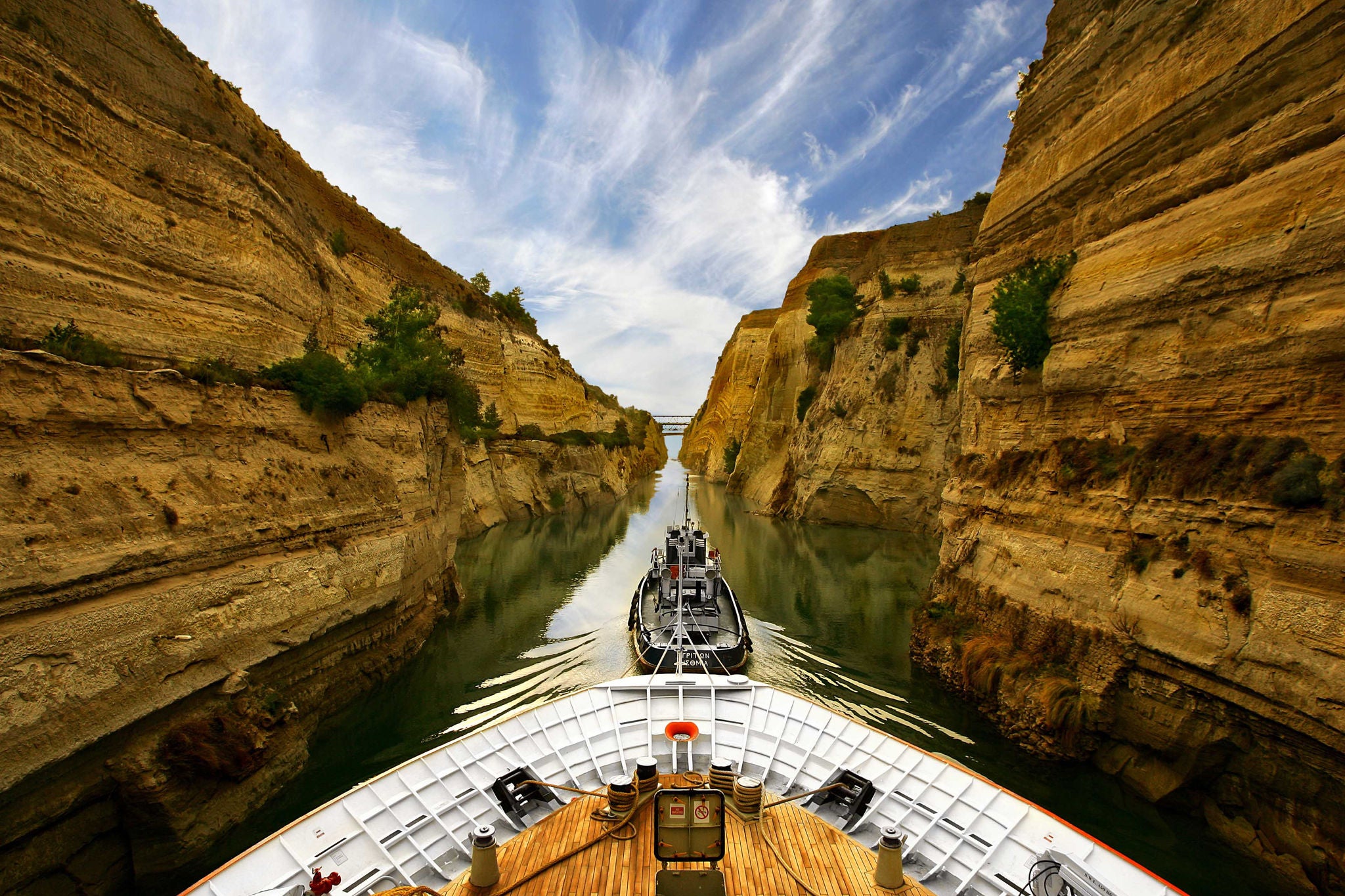 Ships sailing between rocks