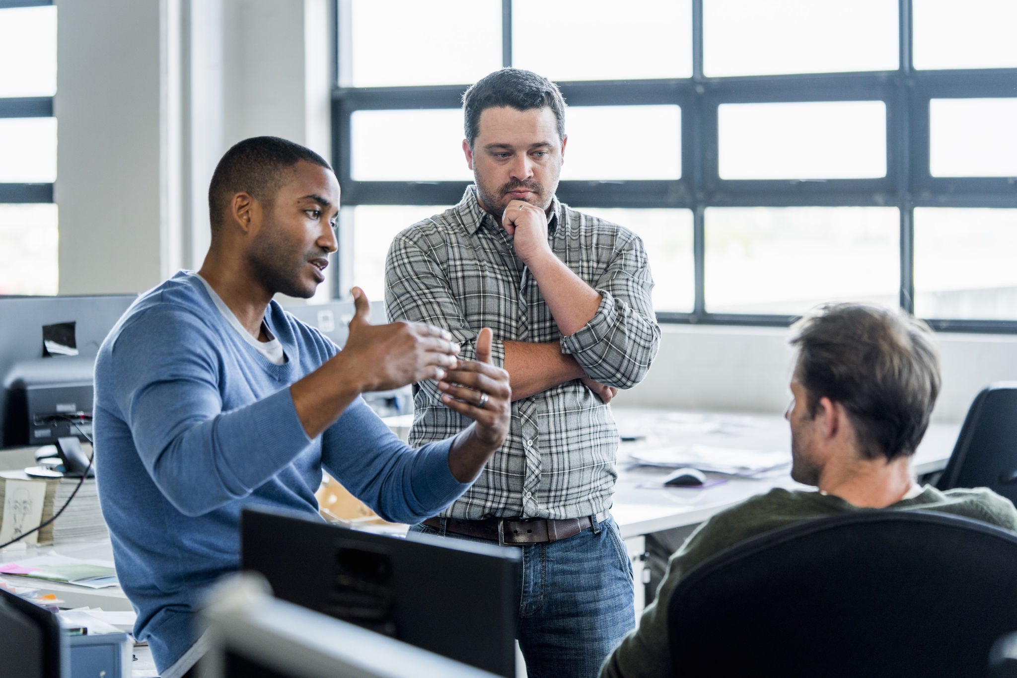 Businessmen discussing in office