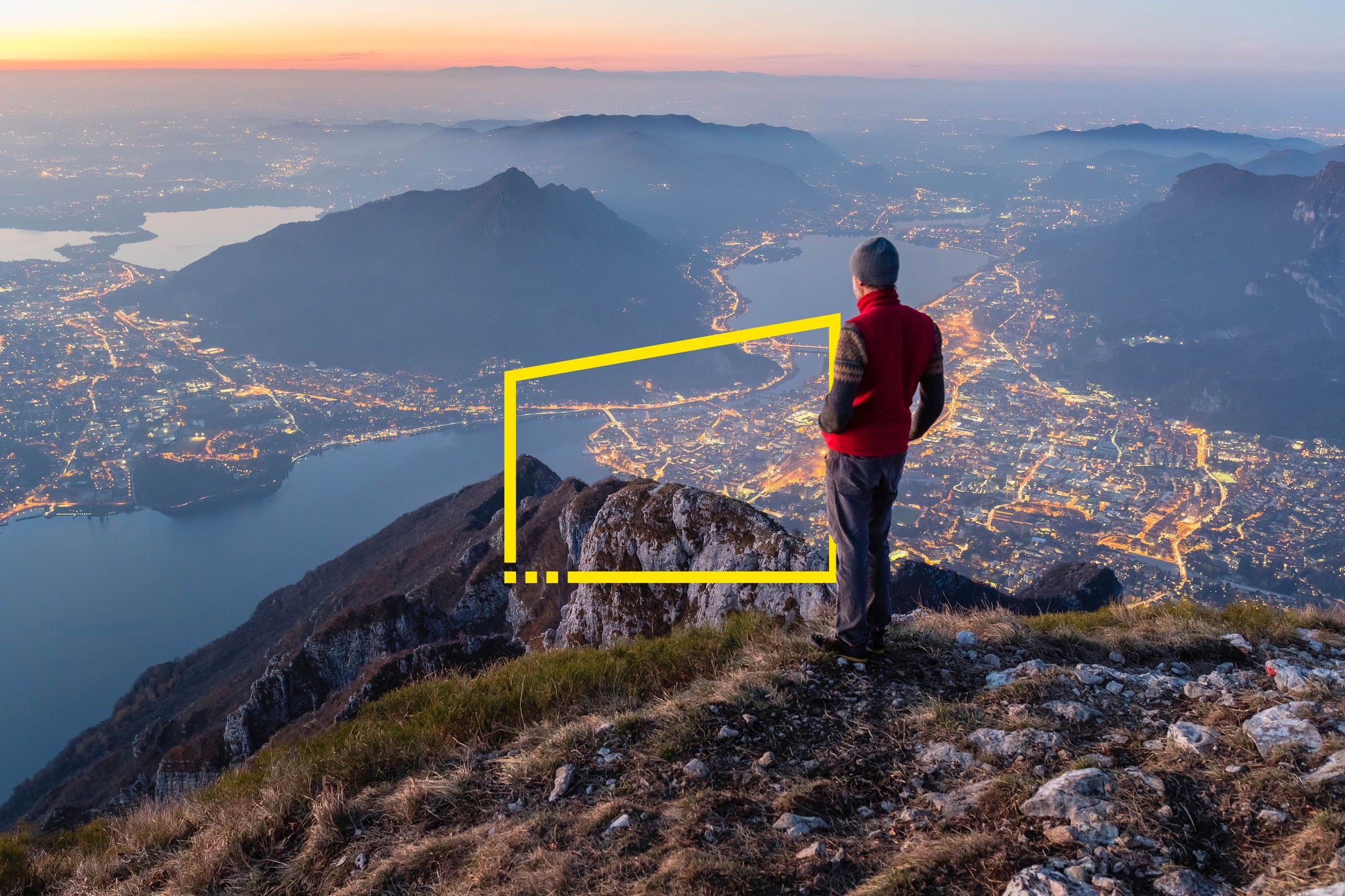 Hikers on the top of the mountain above the city